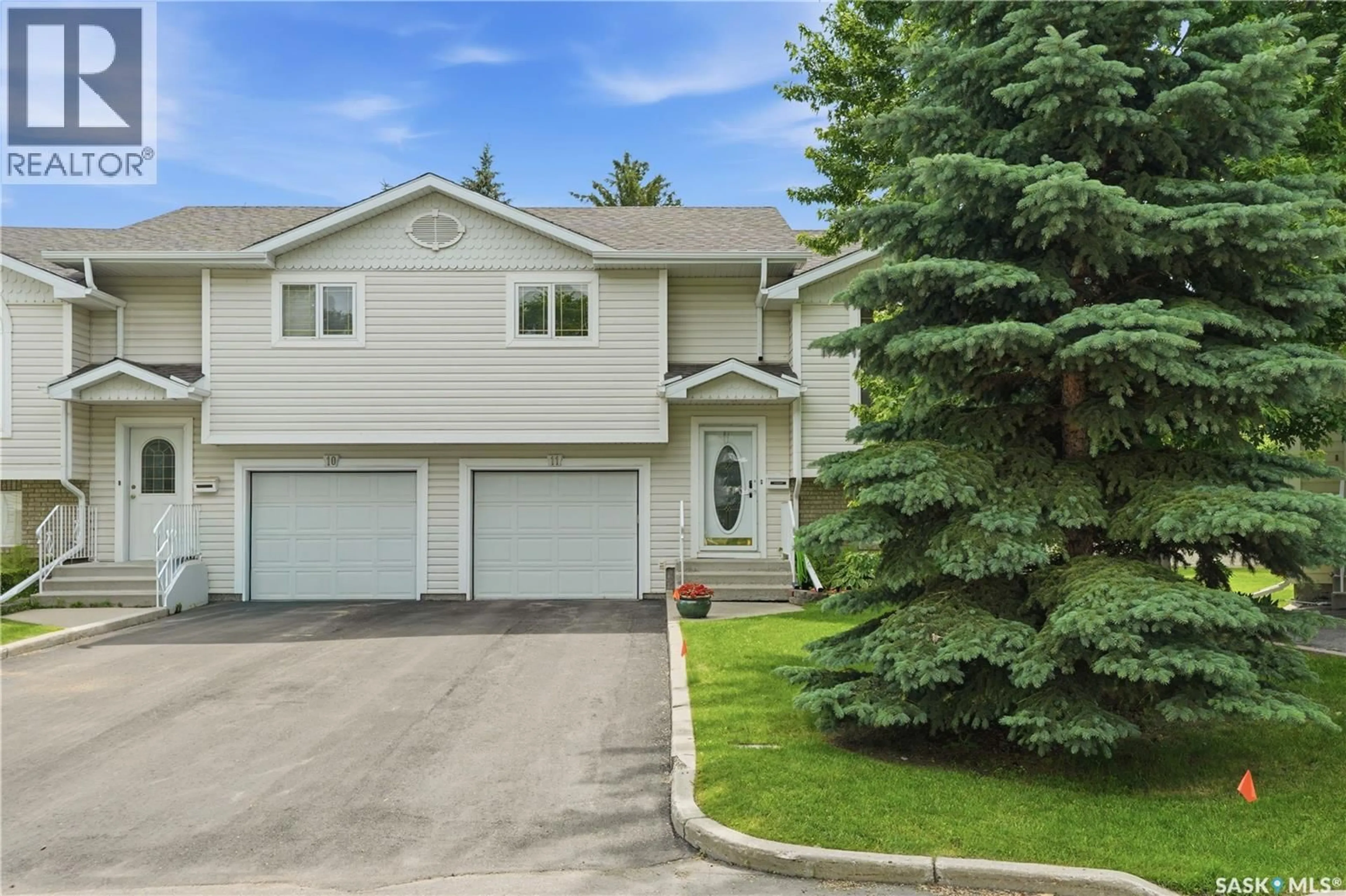 Home with vinyl exterior material, street for 11 605 PEREHUDOFF CRESCENT, Saskatoon Saskatchewan S7N4N7