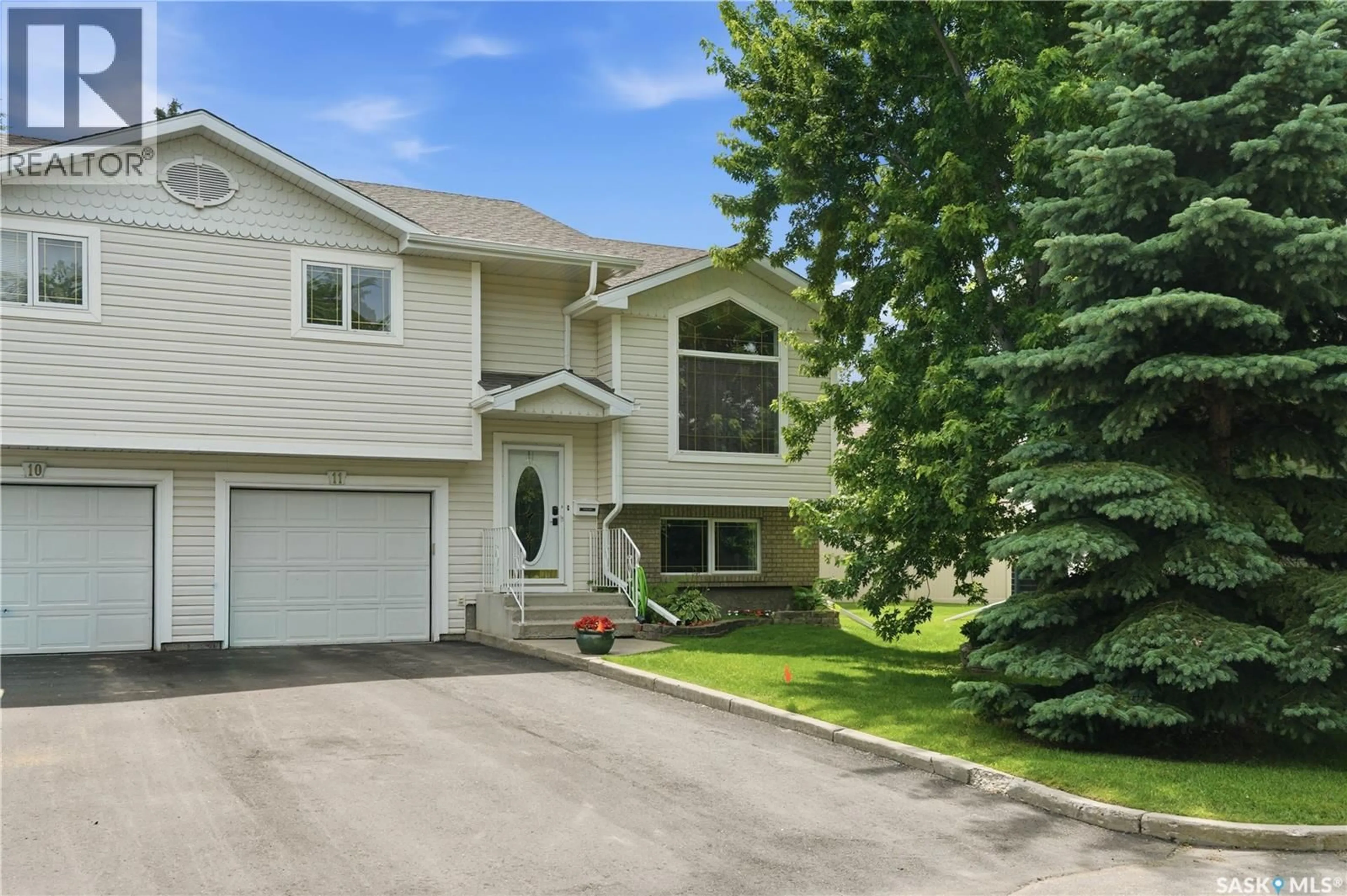 Home with vinyl exterior material, street for 11 605 PEREHUDOFF CRESCENT, Saskatoon Saskatchewan S7N4N7
