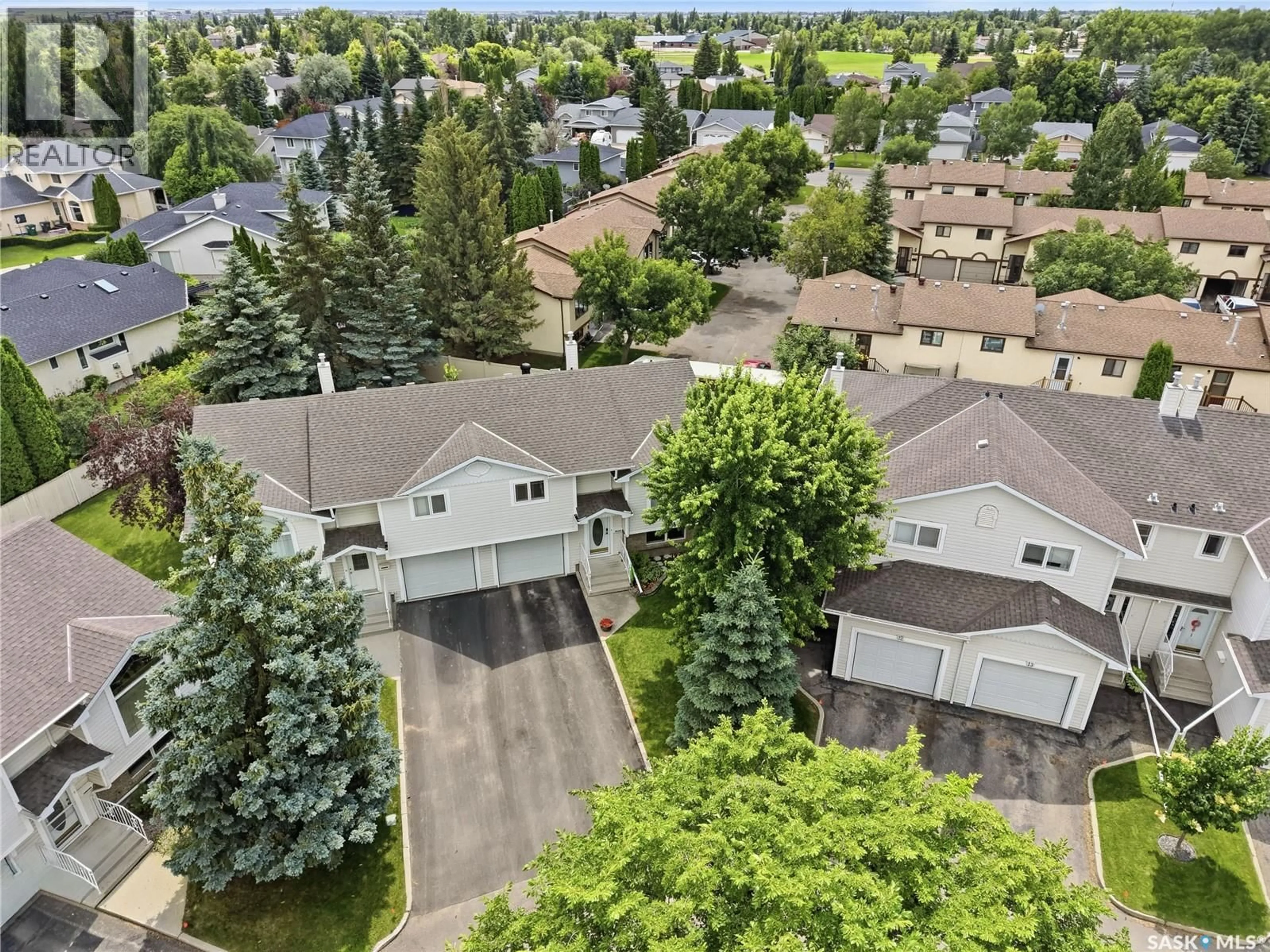A pic from outside/outdoor area/front of a property/back of a property/a pic from drone, street for 11 605 PEREHUDOFF CRESCENT, Saskatoon Saskatchewan S7N4N7