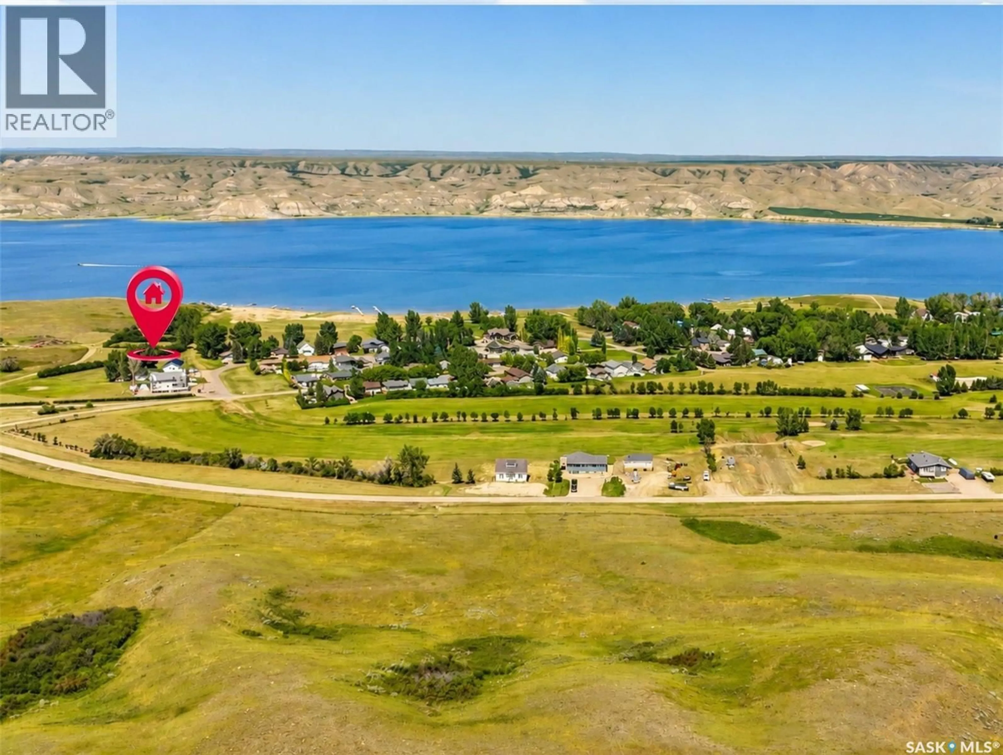 A pic from outside/outdoor area/front of a property/back of a property/a pic from drone, water/lake/river/ocean view for 403 SMITH CRESCENT, Beaver Flat Saskatchewan S0N2P0