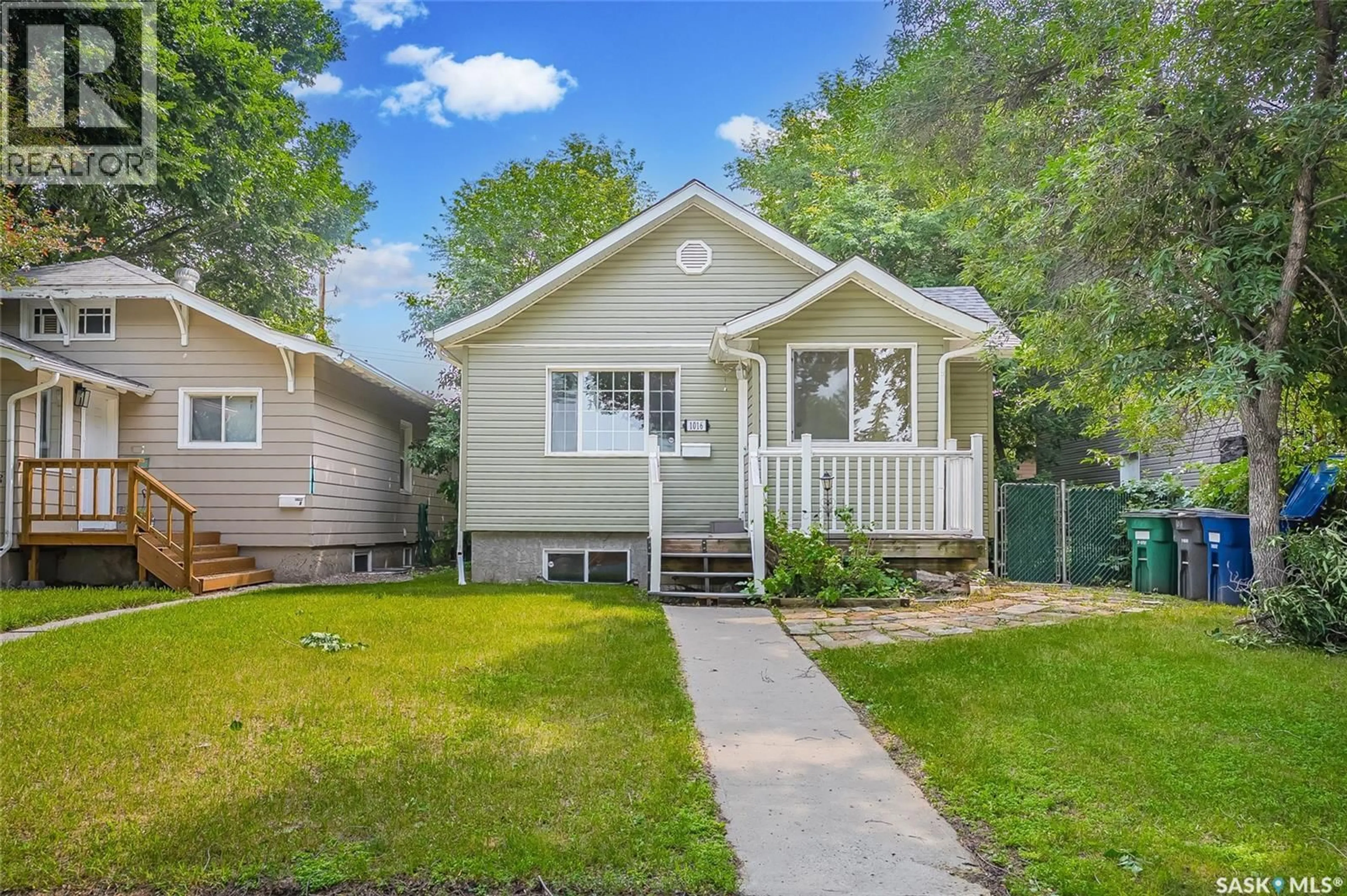 Home with vinyl exterior material, street for 1016 K AVENUE, Saskatoon Saskatchewan S7L2N6