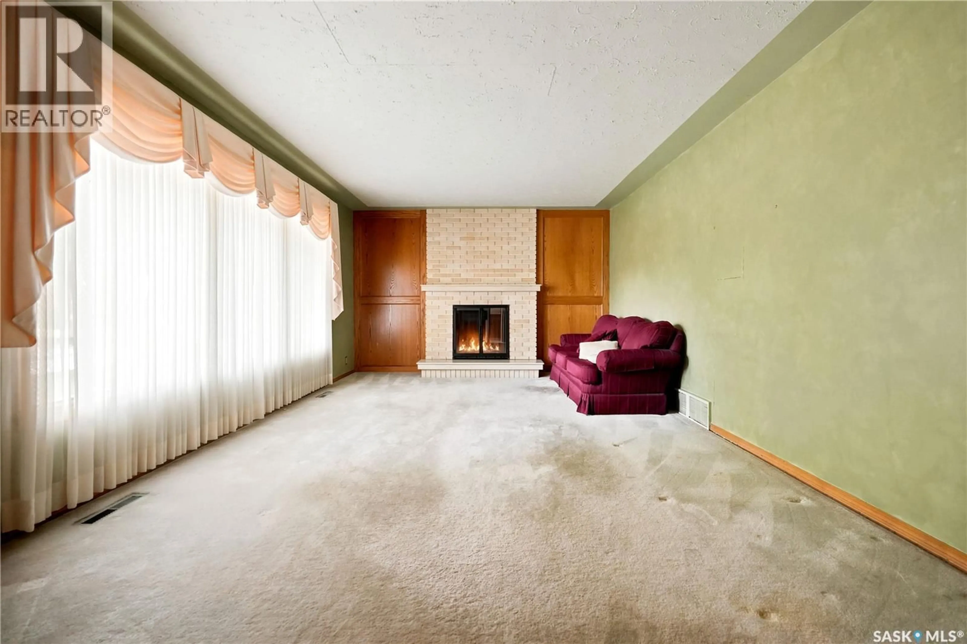 Living room with furniture, carpet floor for 619 MURRAY AVENUE, Regina Saskatchewan S4N1K1