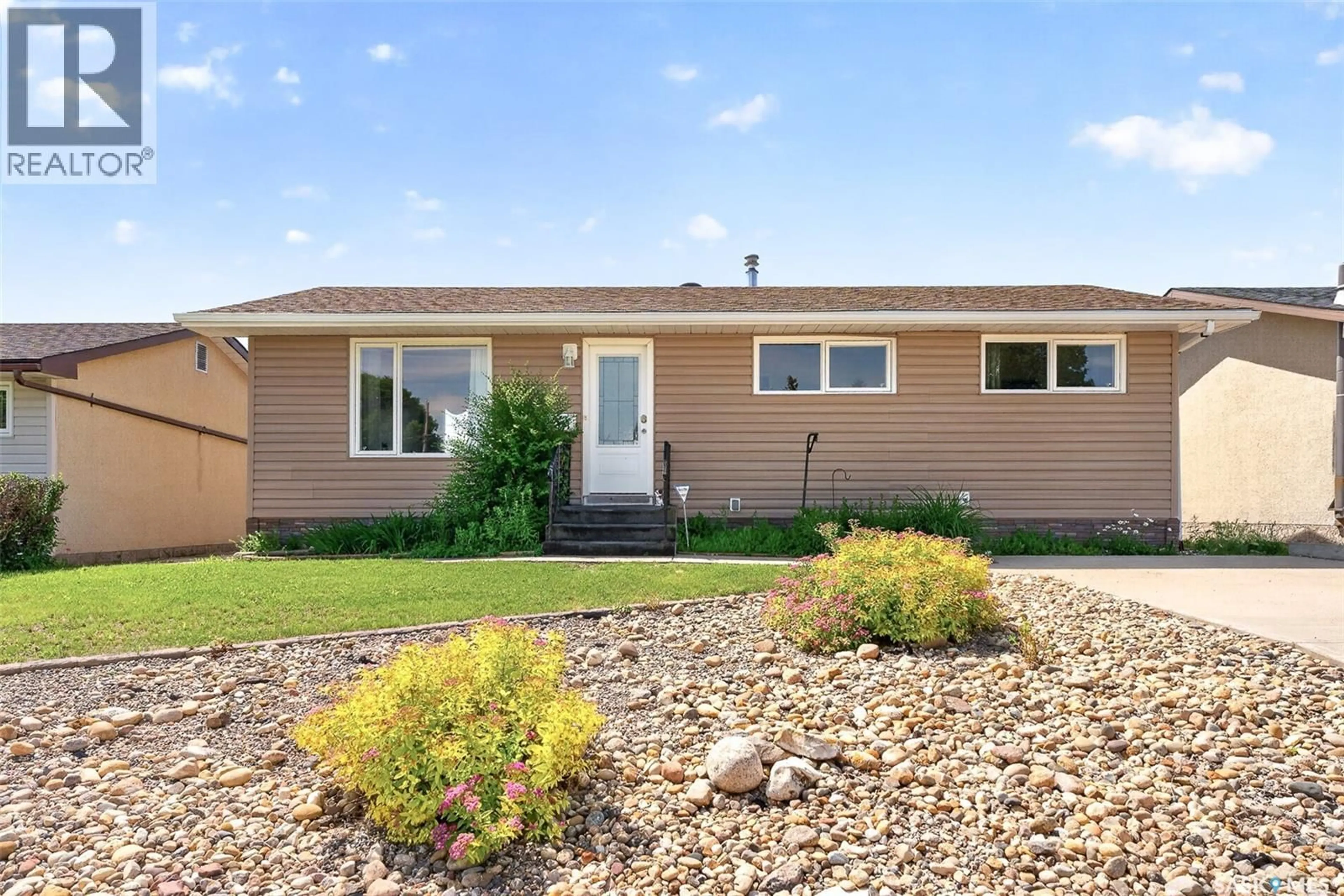 Home with vinyl exterior material, street for 1311 STADACONA STREET, Moose Jaw Saskatchewan S6H6L4