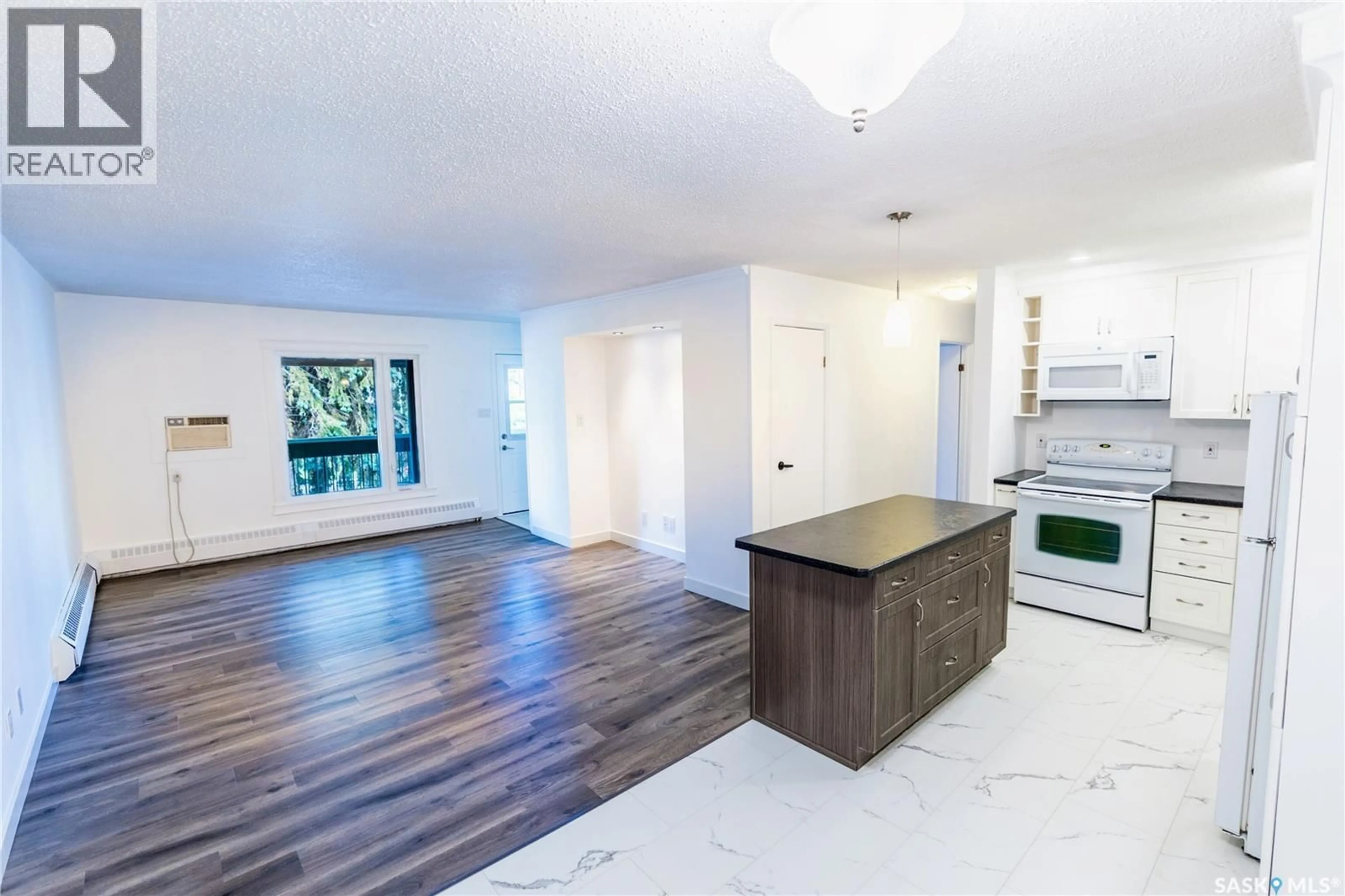 Open concept kitchen, wood/laminate floor for 8 NOLLET AVENUE, Regina Saskatchewan S4T7P9