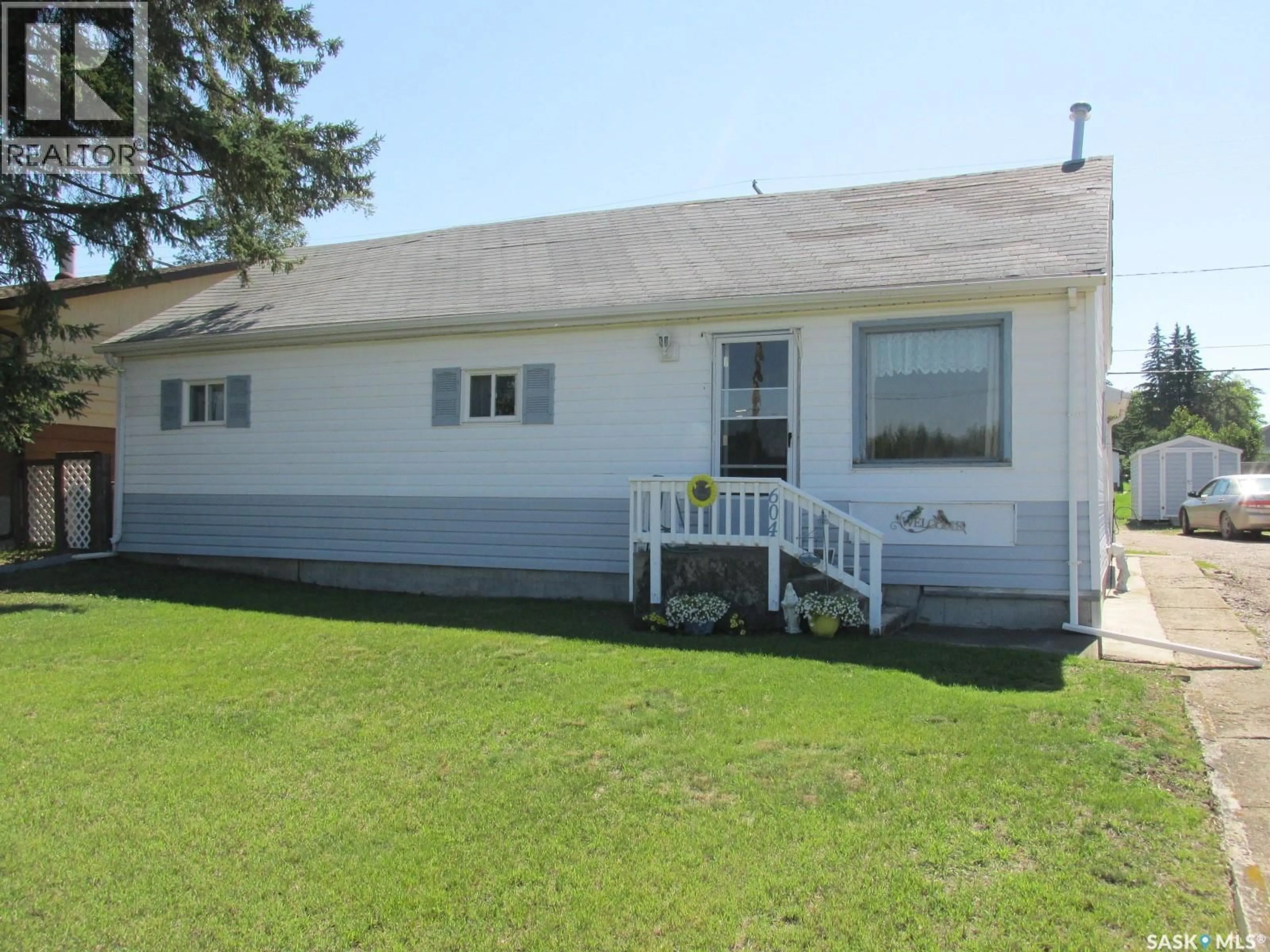 Home with vinyl exterior material, street for 604 RAILWAY AVENUE, Nipawin Saskatchewan S0E1E0