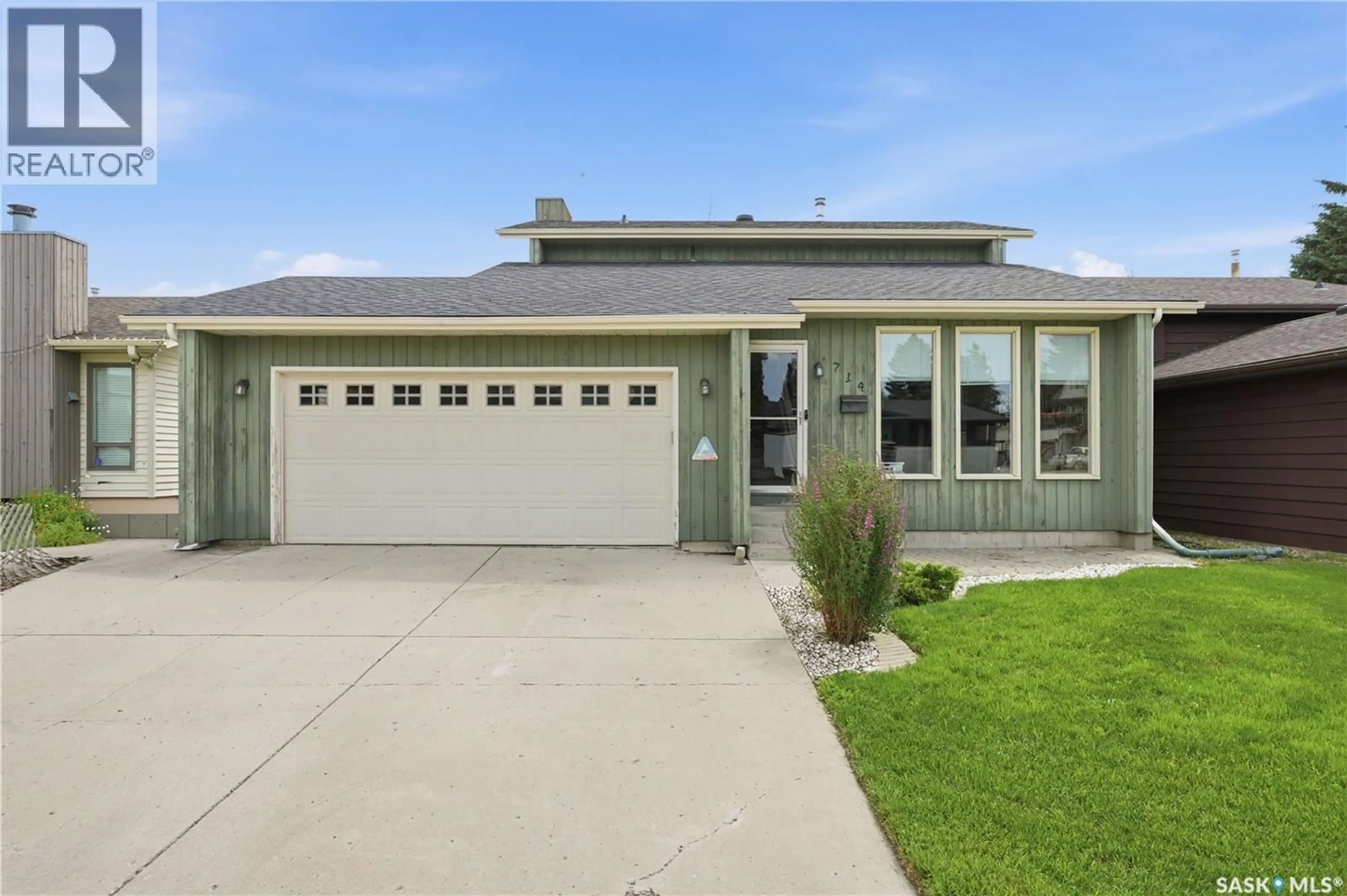 Home with vinyl exterior material, street for 714 DELARONDE CRESCENT, Saskatoon Saskatchewan S7J3Z8