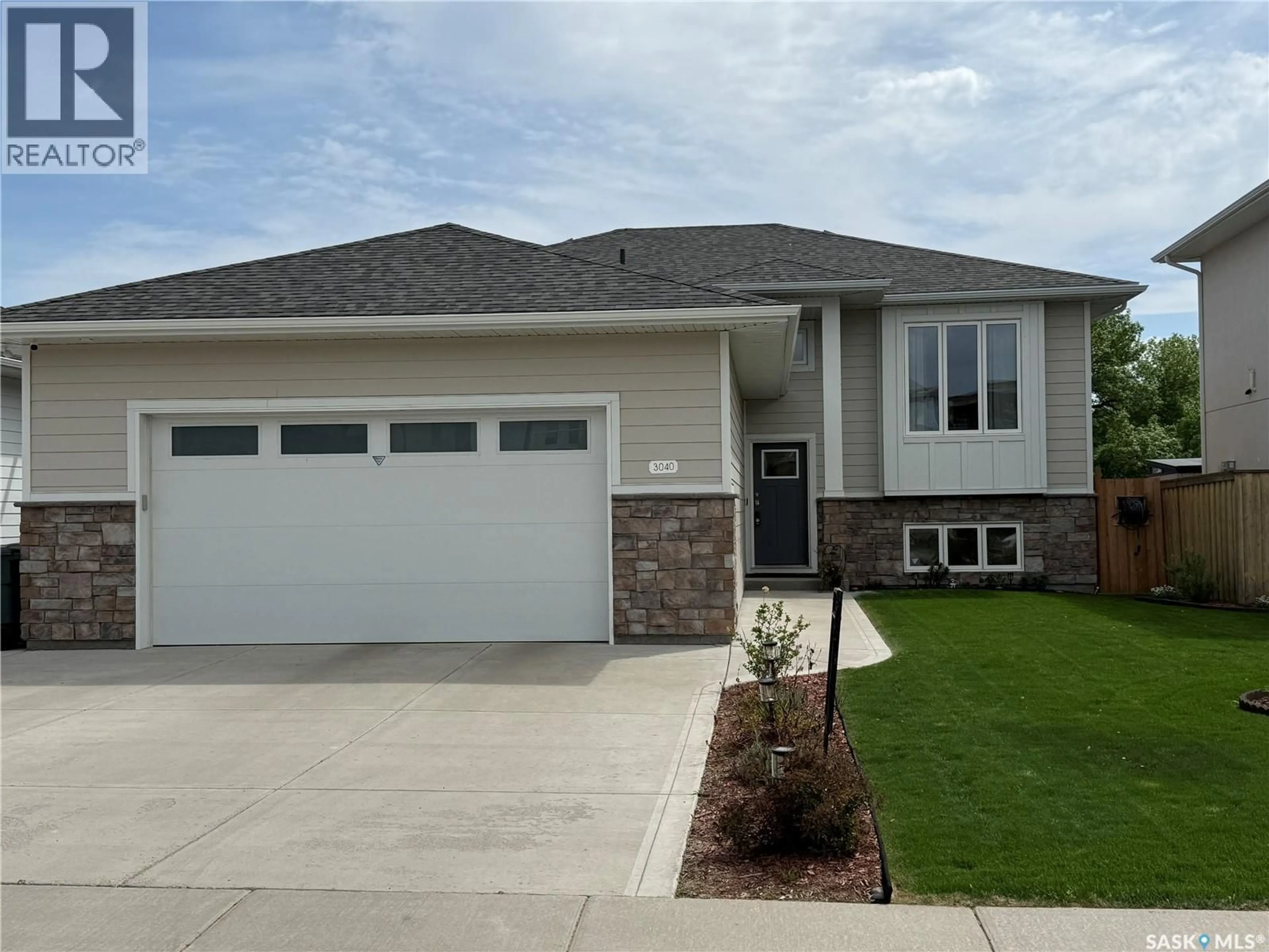 Home with vinyl exterior material, street for 3040 LAKEVIEW DRIVE, Prince Albert Saskatchewan S6W0A4