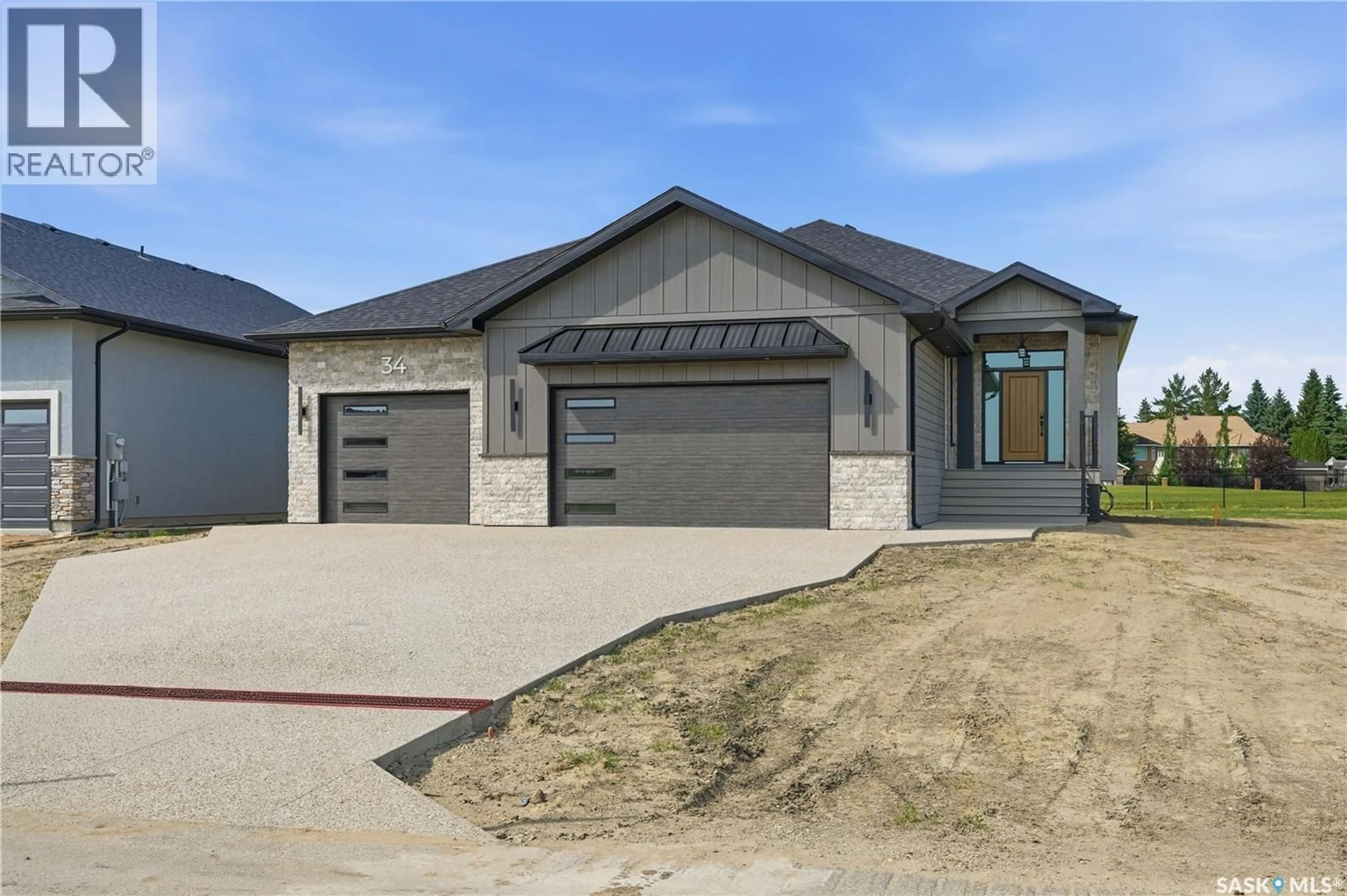 Home with brick exterior material, street for 34 HUBER DRIVE, Edenwold Rm No.158 Saskatchewan S4L0E7