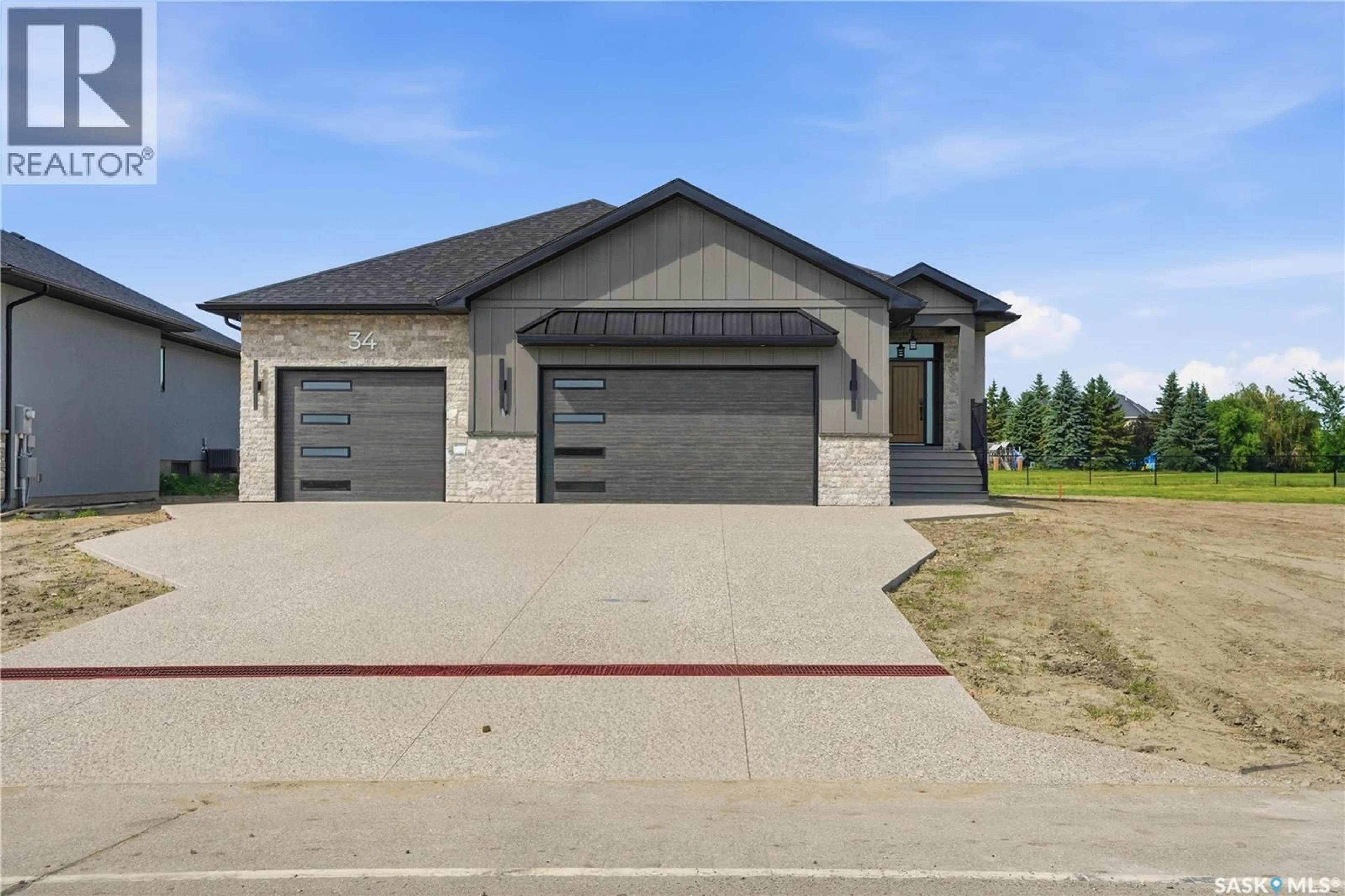 Home with brick exterior material, street for 34 HUBER DRIVE, Edenwold Rm No.158 Saskatchewan S4L0E7