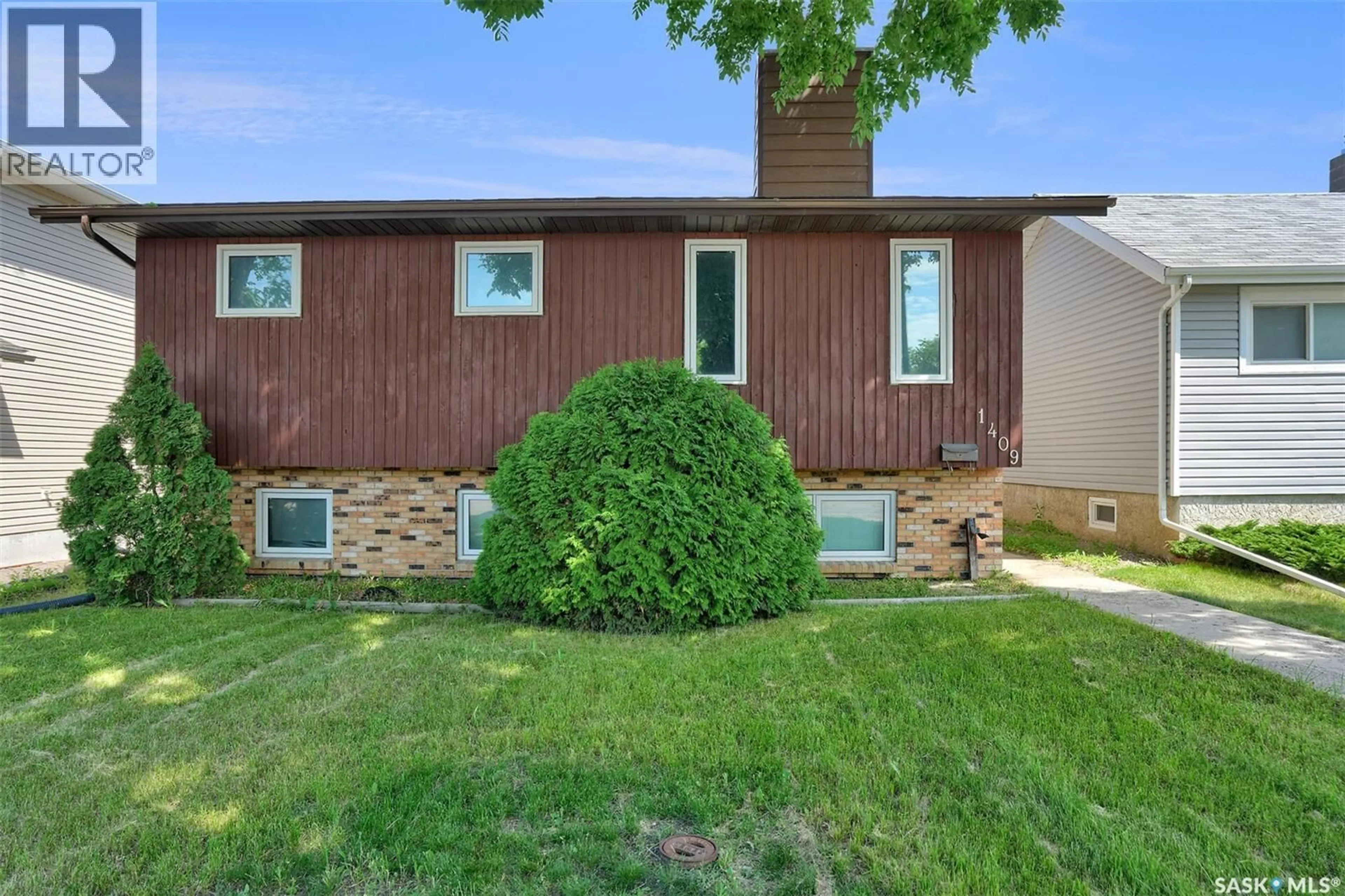 Home with vinyl exterior material, street for 1409 ROTHWELL STREET, Regina Saskatchewan S4N2B4