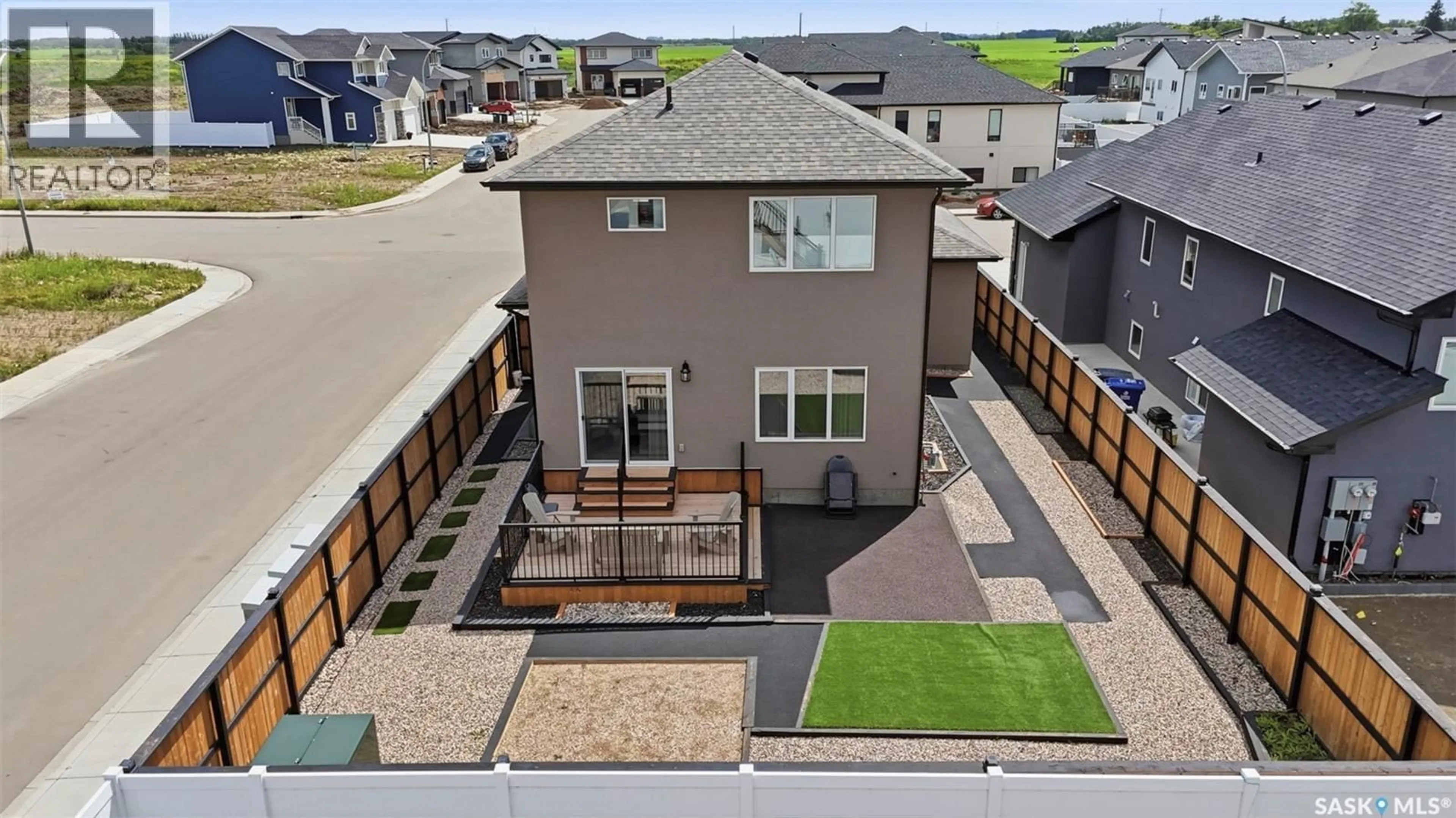 A pic from outside/outdoor area/front of a property/back of a property/a pic from drone, street for 2435 ROSEWOOD DRIVE, Saskatoon Saskatchewan S7V0Z3