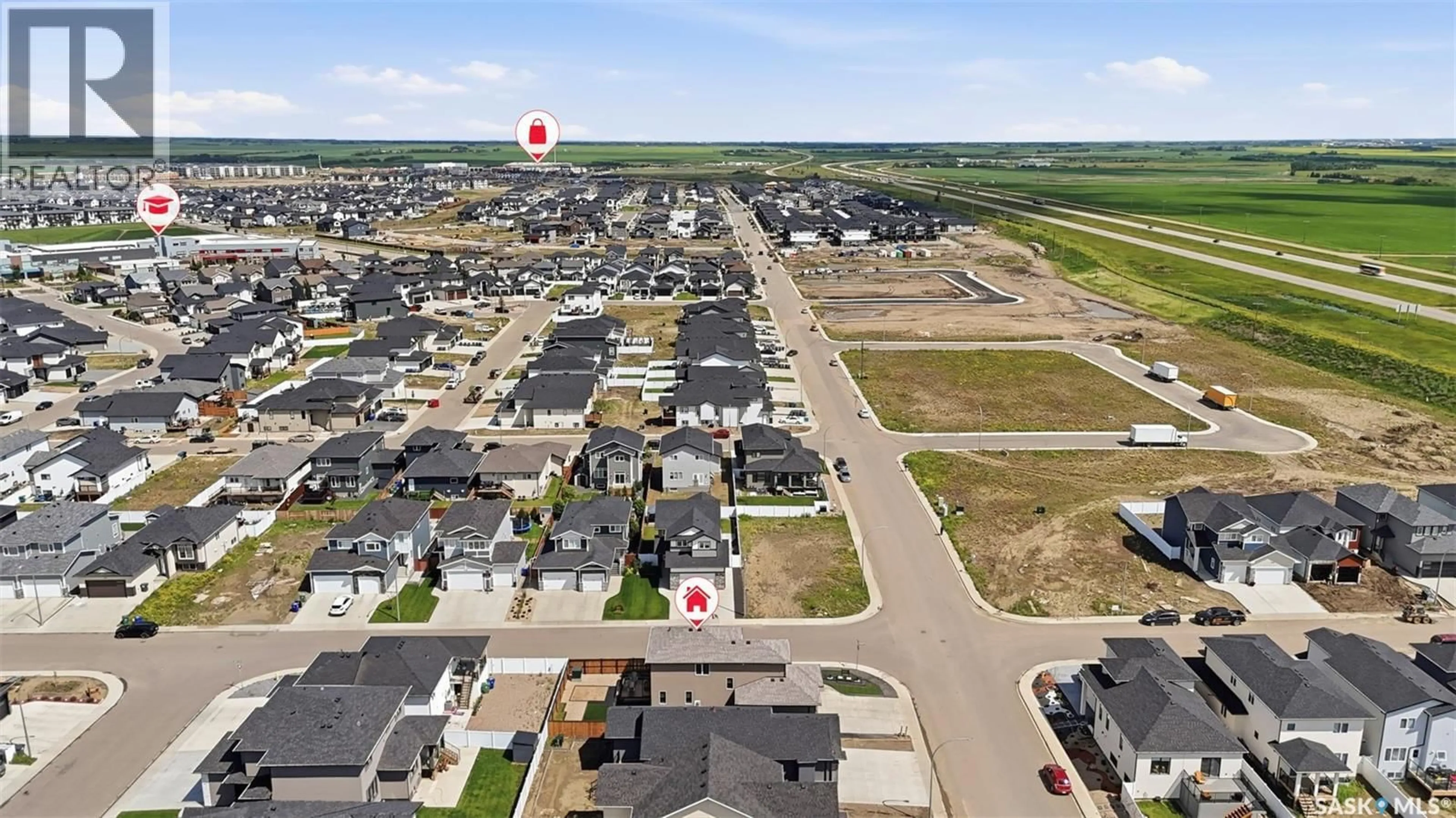 A pic from outside/outdoor area/front of a property/back of a property/a pic from drone, street for 2435 ROSEWOOD DRIVE, Saskatoon Saskatchewan S7V0Z3