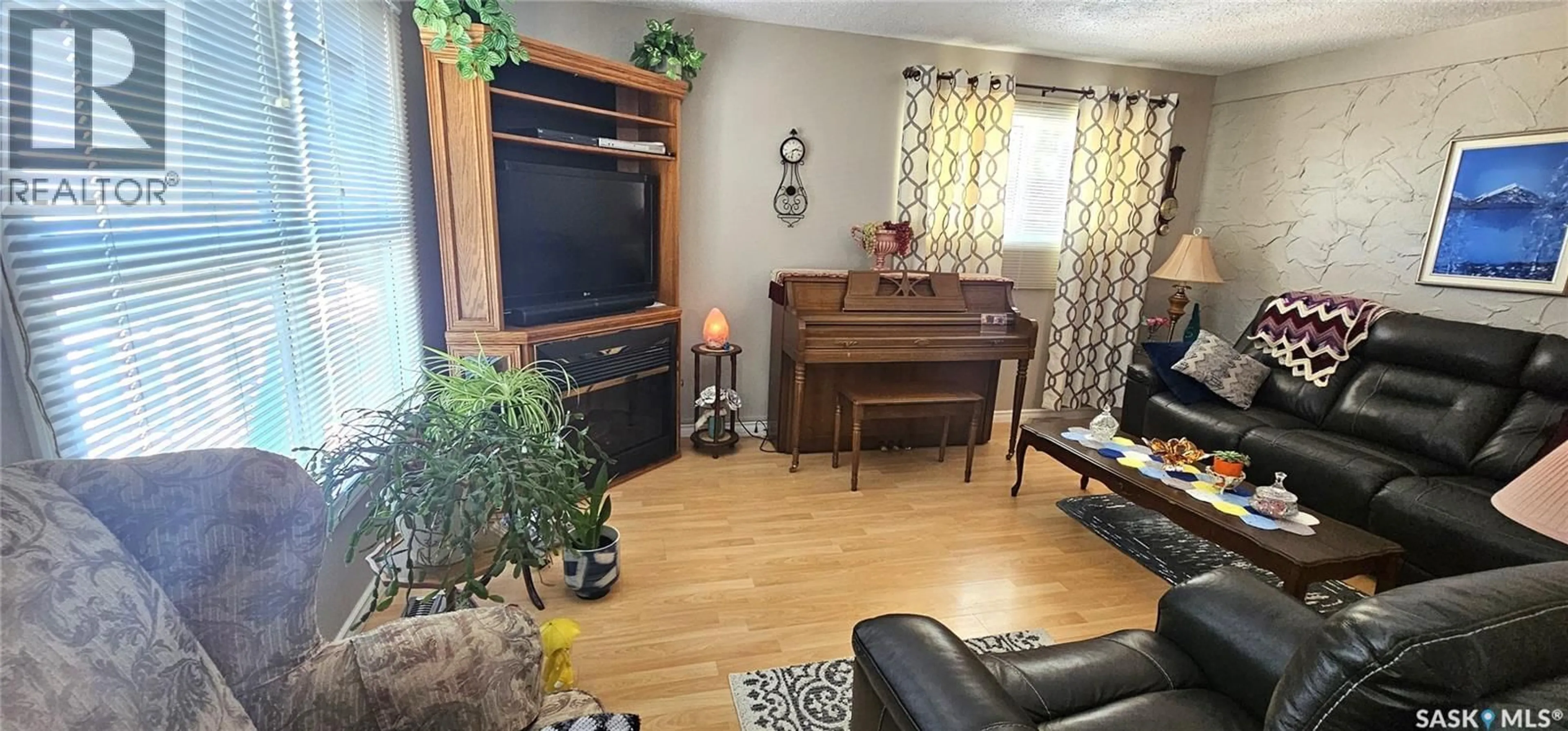 Living room with furniture, wood/laminate floor for 330 COTEAU STREET, Milestone Saskatchewan S0G3L0