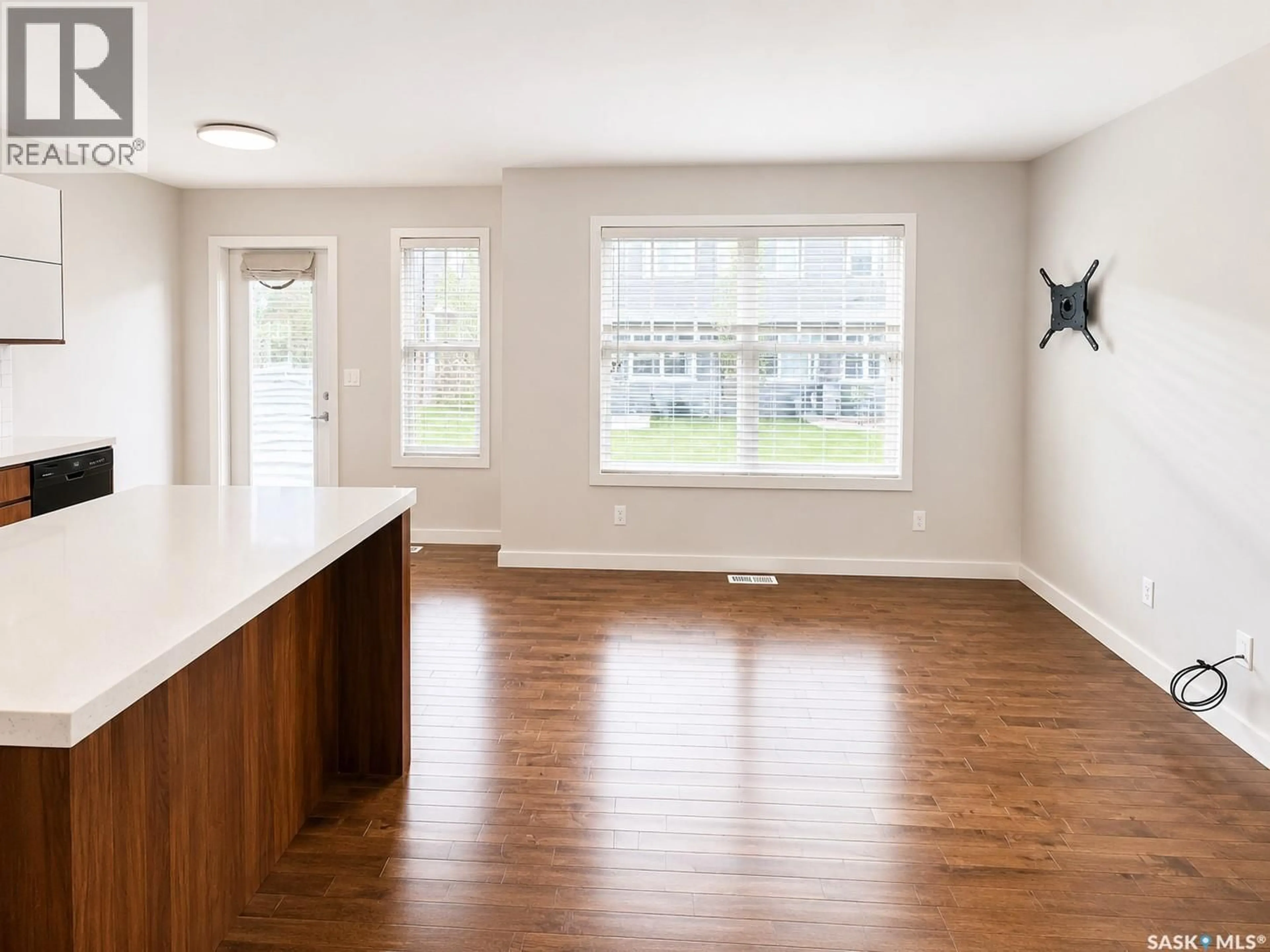 Open concept kitchen, wood/laminate floor for 405 455 REMPEL LANE, Saskatoon Saskatchewan S7T0R9