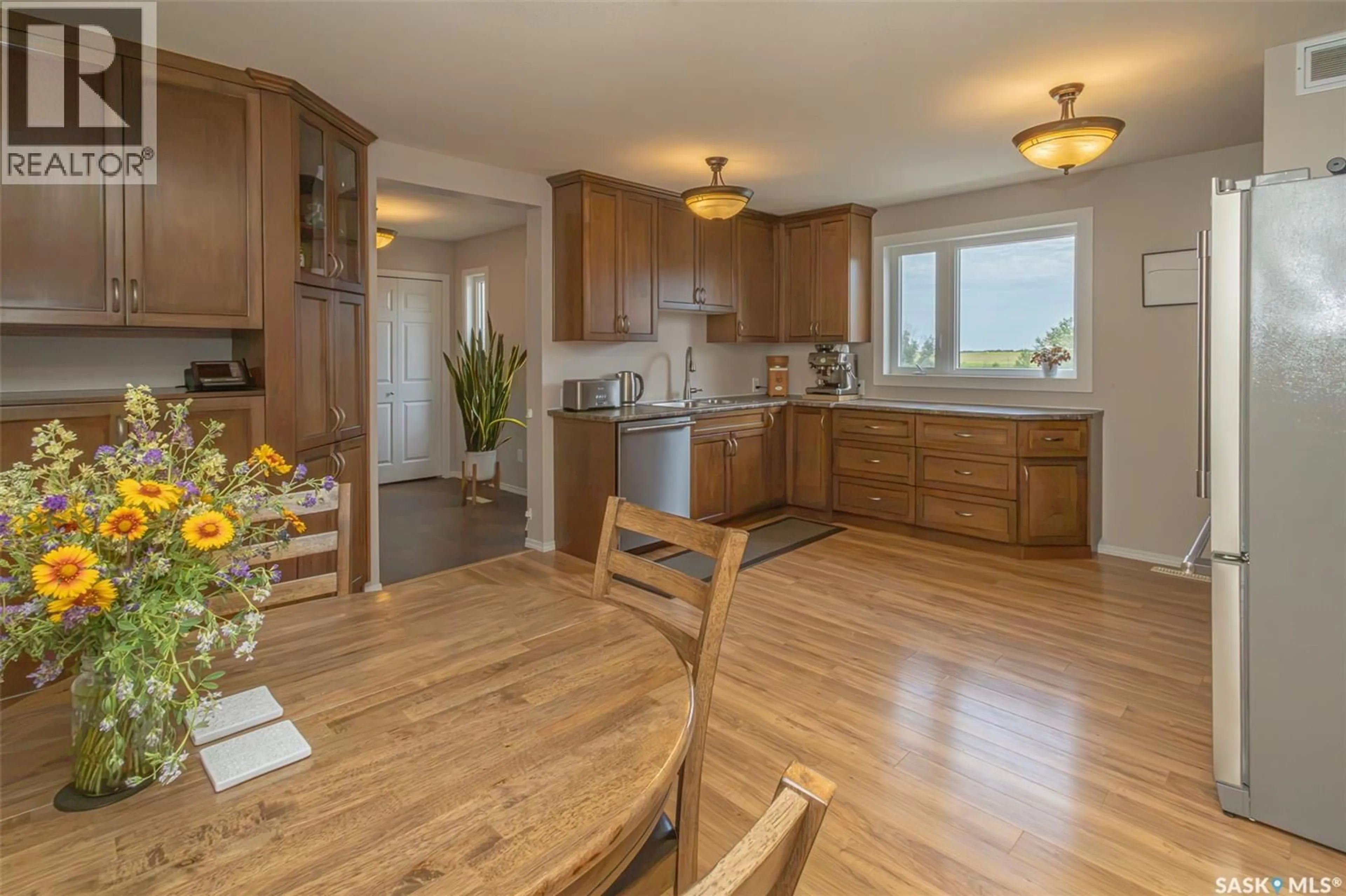 Open concept kitchen, wood/laminate floor for ENTZ ACREAGE, Corman Park Rm No. 344 Saskatchewan S0K2L0
