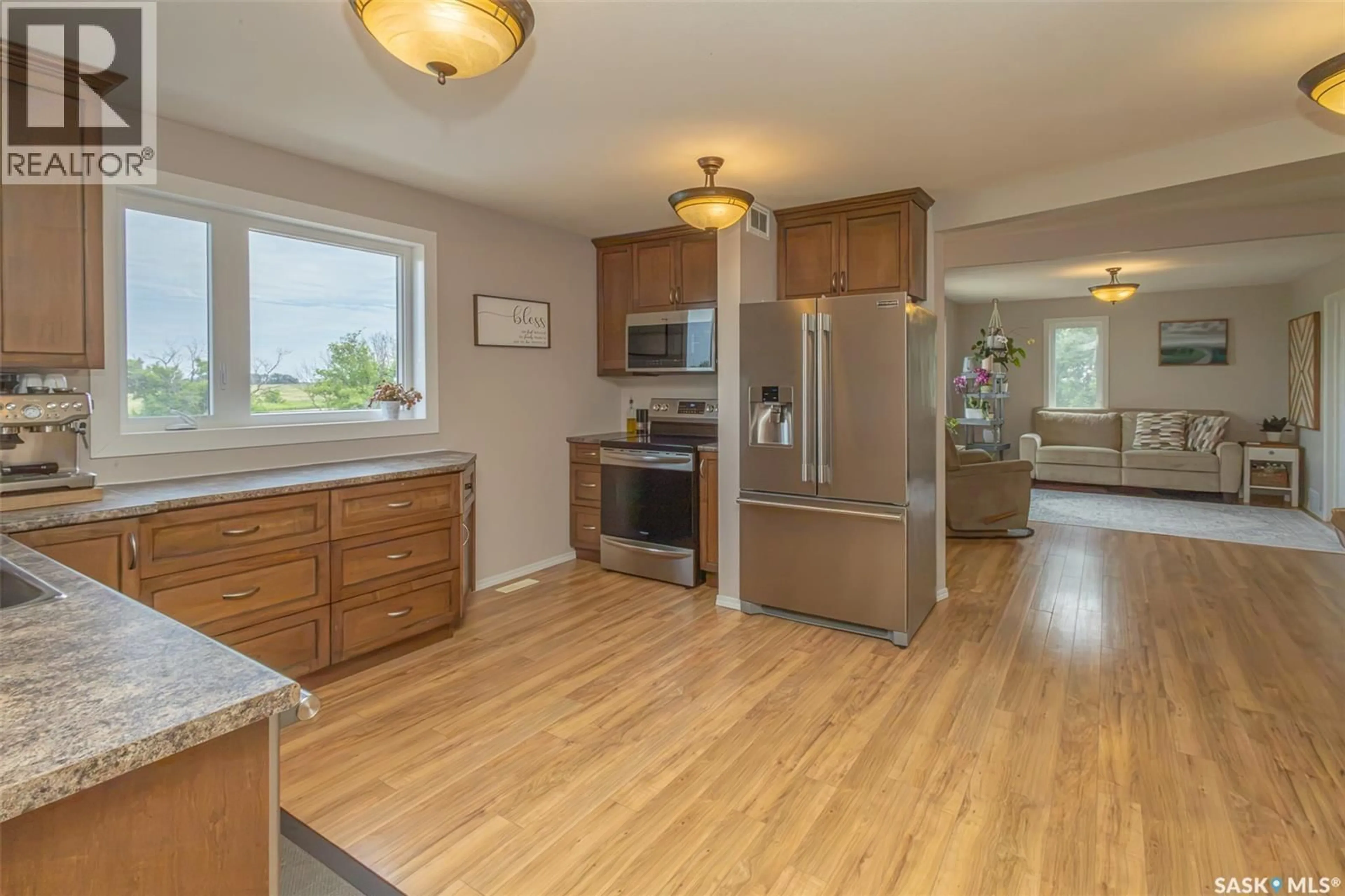 Open concept kitchen, wood/laminate floor for ENTZ ACREAGE, Corman Park Rm No. 344 Saskatchewan S0K2L0