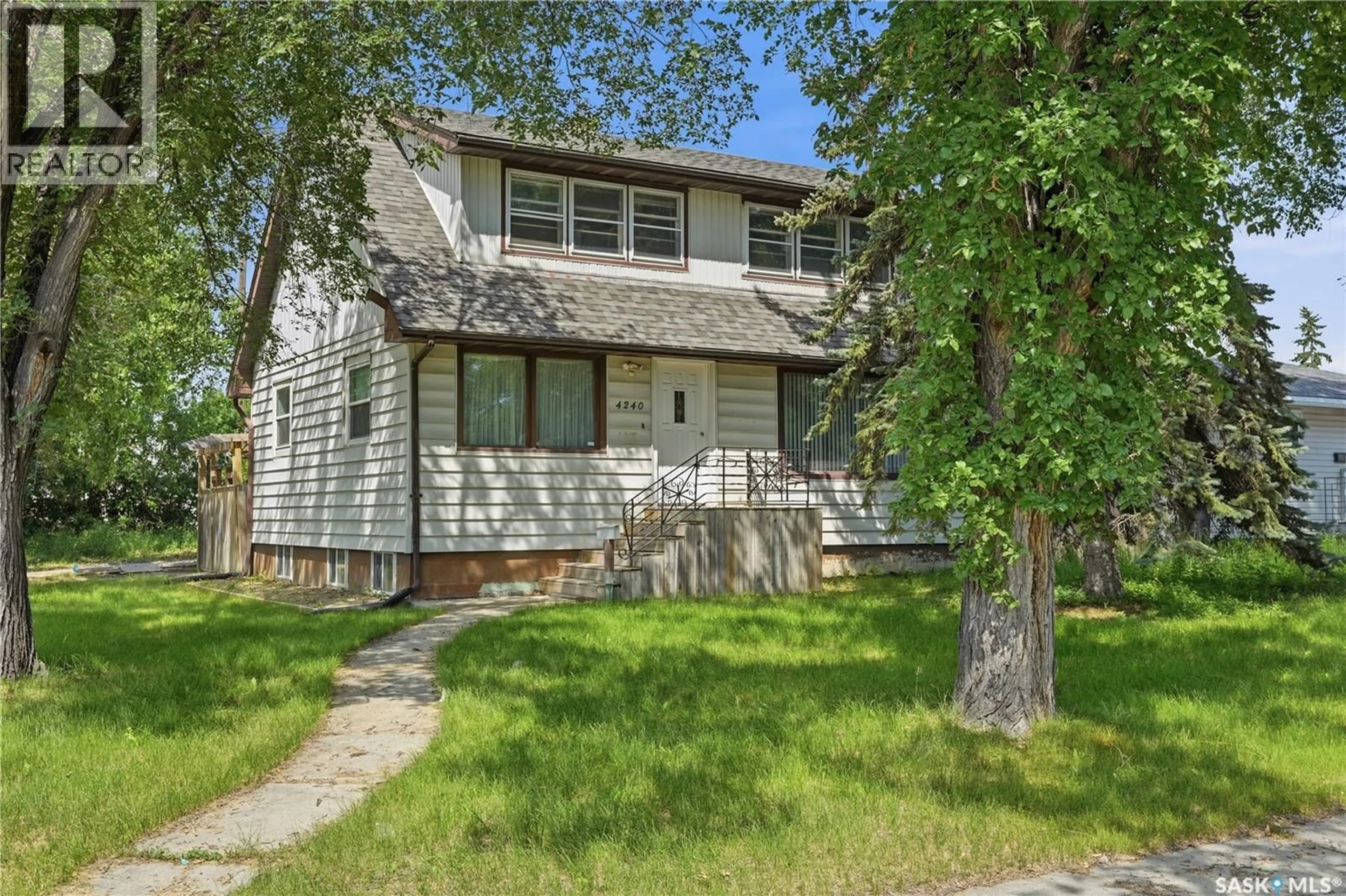 Home with vinyl exterior material, street for 4240 8TH AVENUE, Regina Saskatchewan S4T0T7