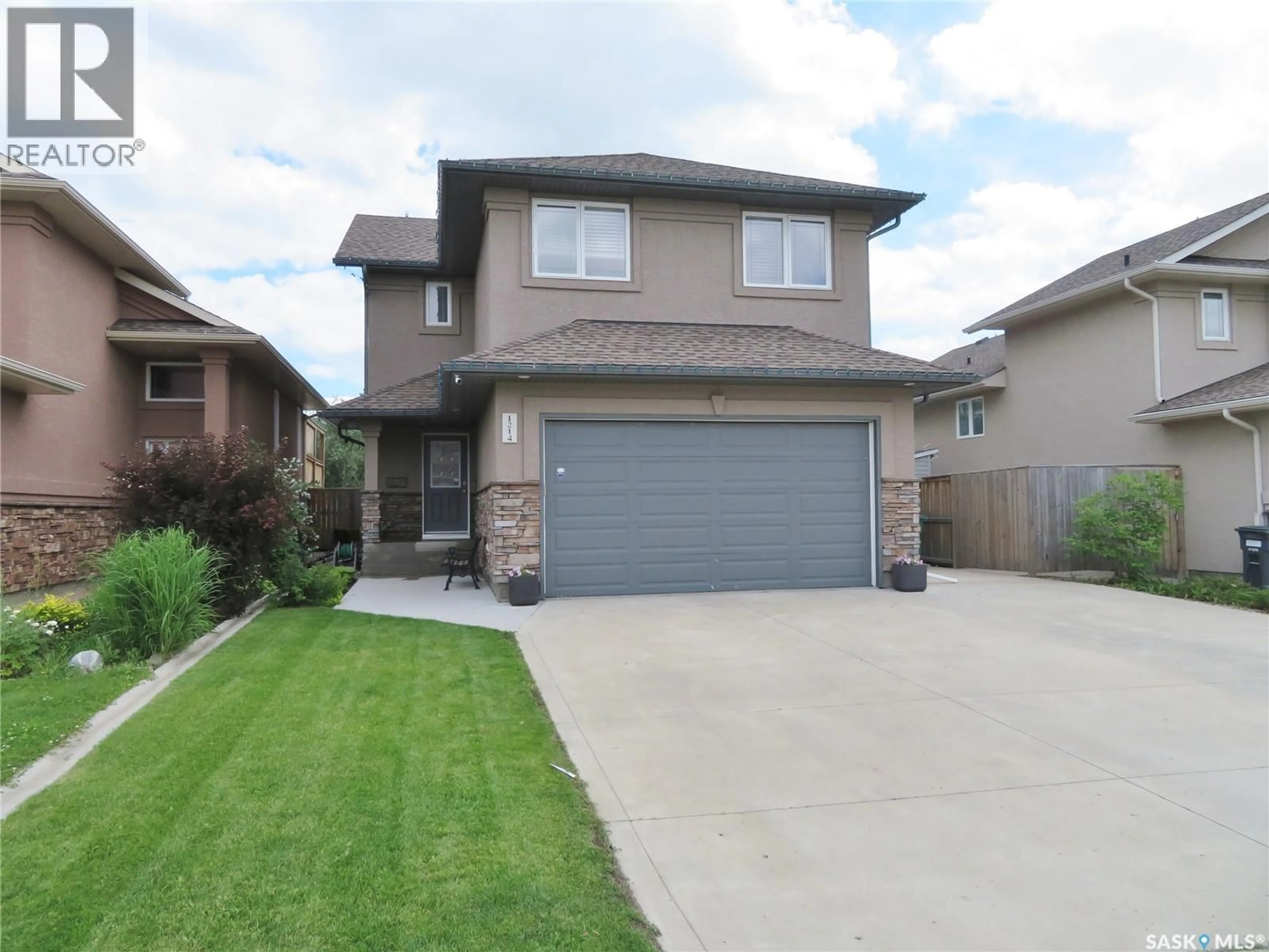 Home with brick exterior material, street for 1214 REMPEL CRESCENT, Saskatoon Saskatchewan S7T0M2