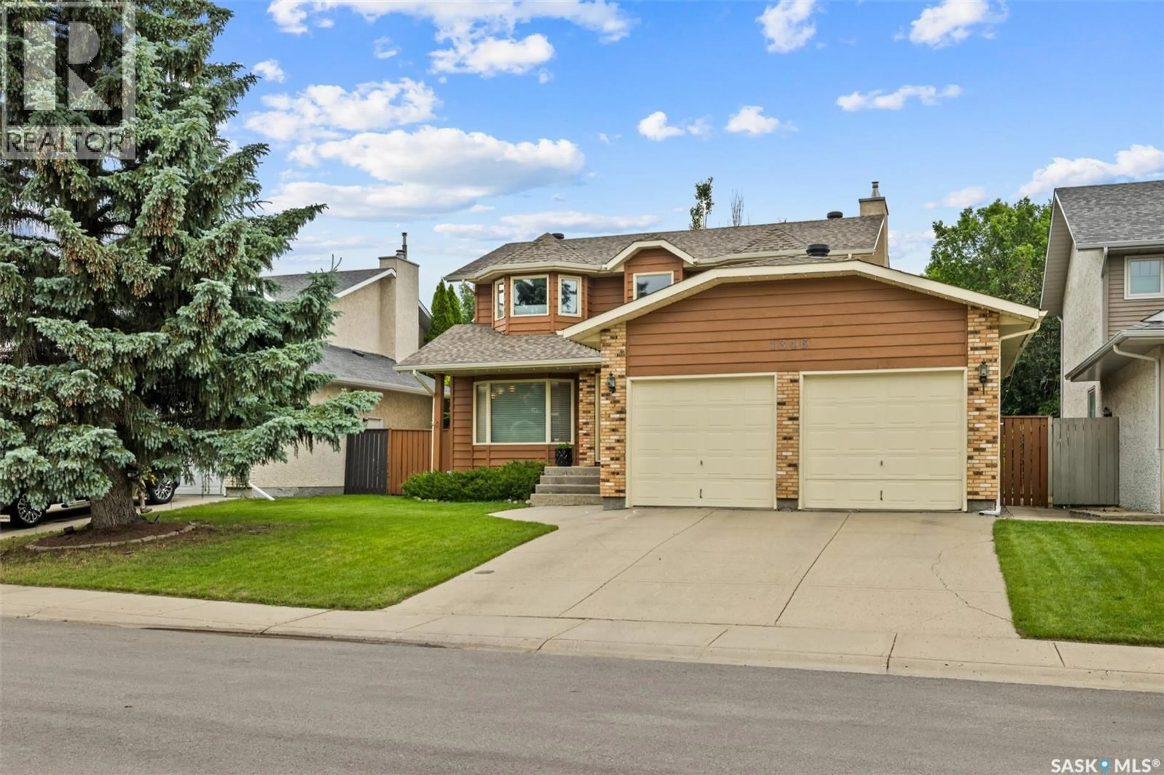 Home with vinyl exterior material, street for 1346 WASCANA HIGHLANDS, Regina Saskatchewan S4V2J9
