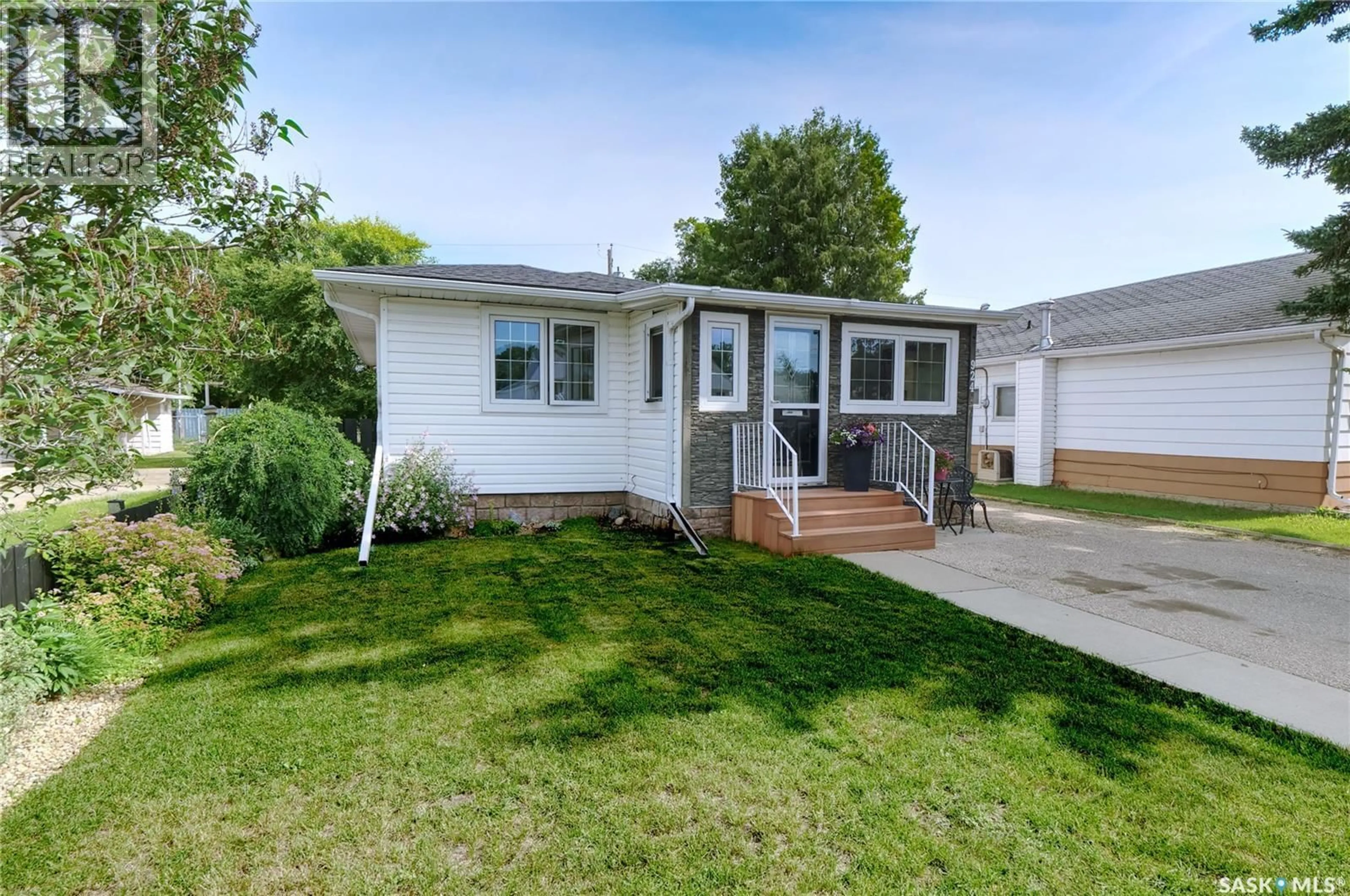 Home with vinyl exterior material, street for 924 HALL STREET, Moose Jaw Saskatchewan S6H2S4