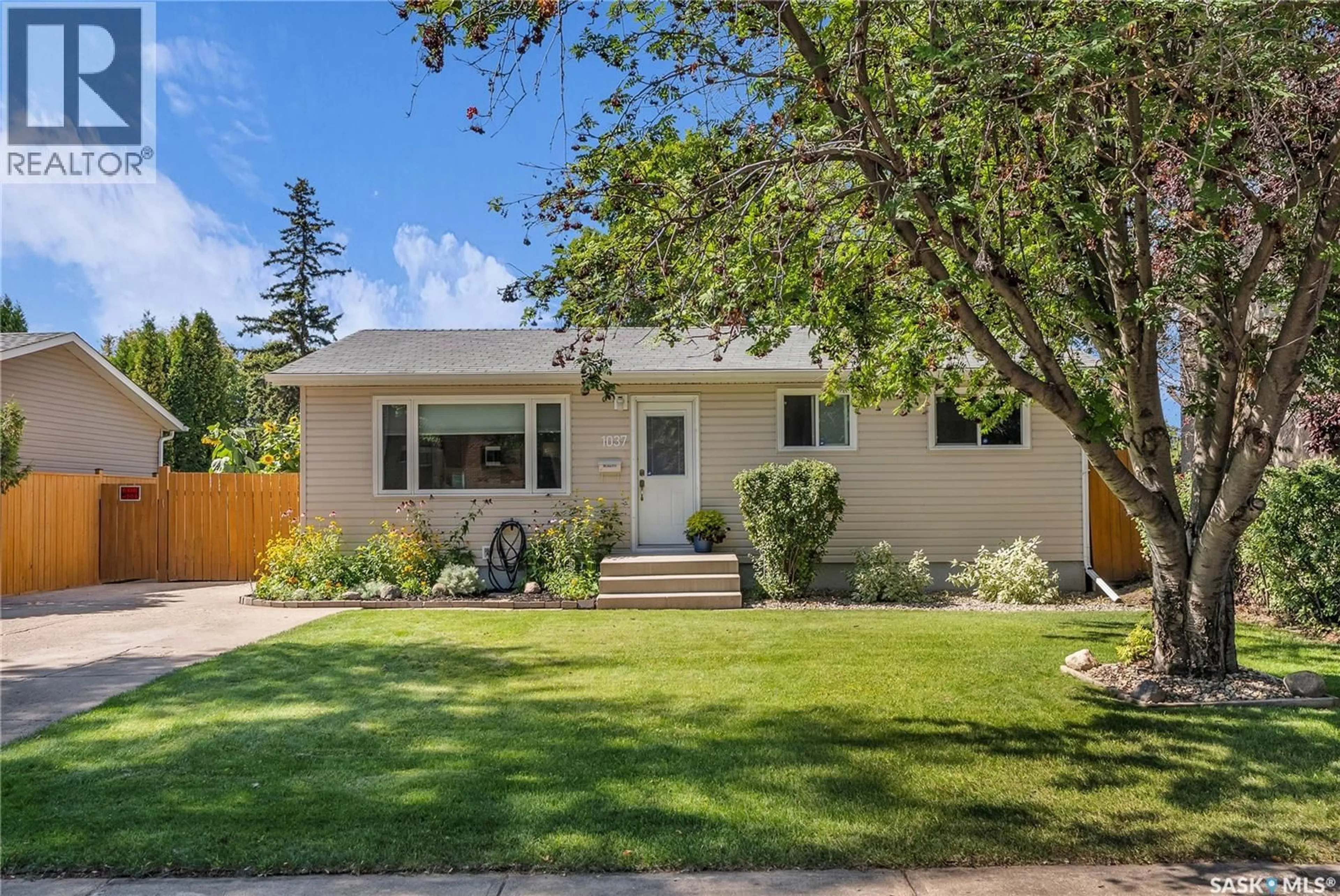 Home with vinyl exterior material, street for 1037 MATHESON DRIVE, Saskatoon Saskatchewan S7L3Y9