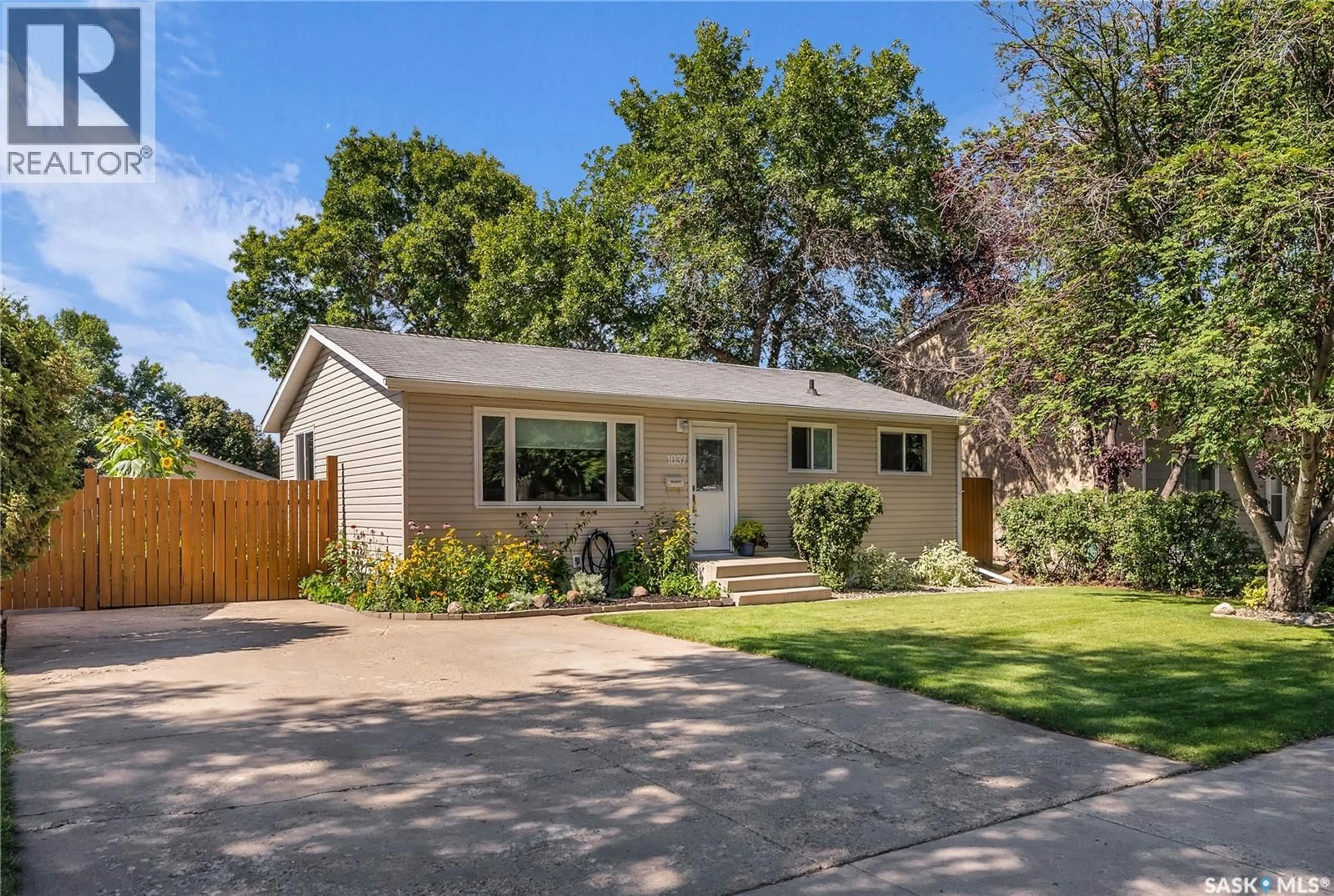 Home with vinyl exterior material, street for 1037 MATHESON DRIVE, Saskatoon Saskatchewan S7L3Y9
