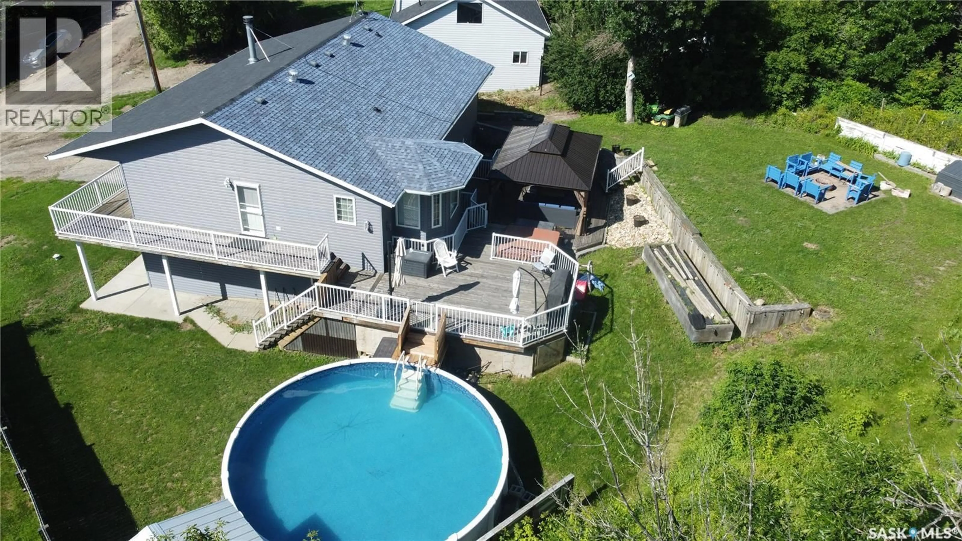 A pic from outside/outdoor area/front of a property/back of a property/a pic from drone, water/lake/river/ocean view for 28 ALICE CRESCENT, North Grove Saskatchewan S0H4C0