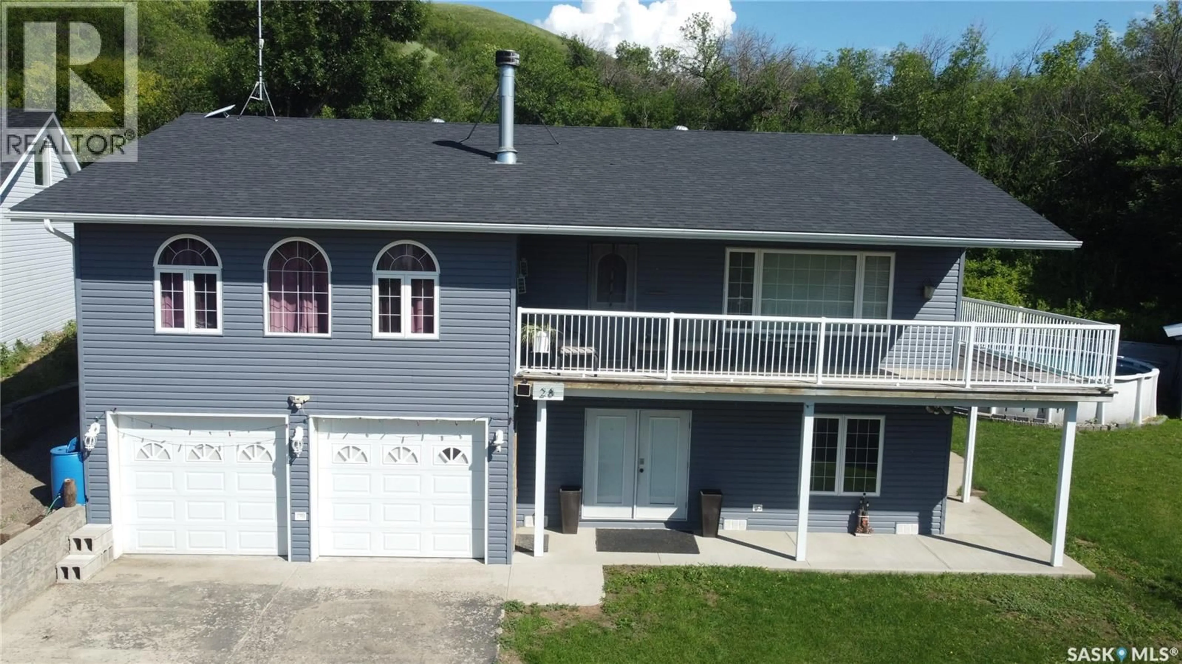 A pic from outside/outdoor area/front of a property/back of a property/a pic from drone, unknown for 28 ALICE CRESCENT, North Grove Saskatchewan S0H4C0