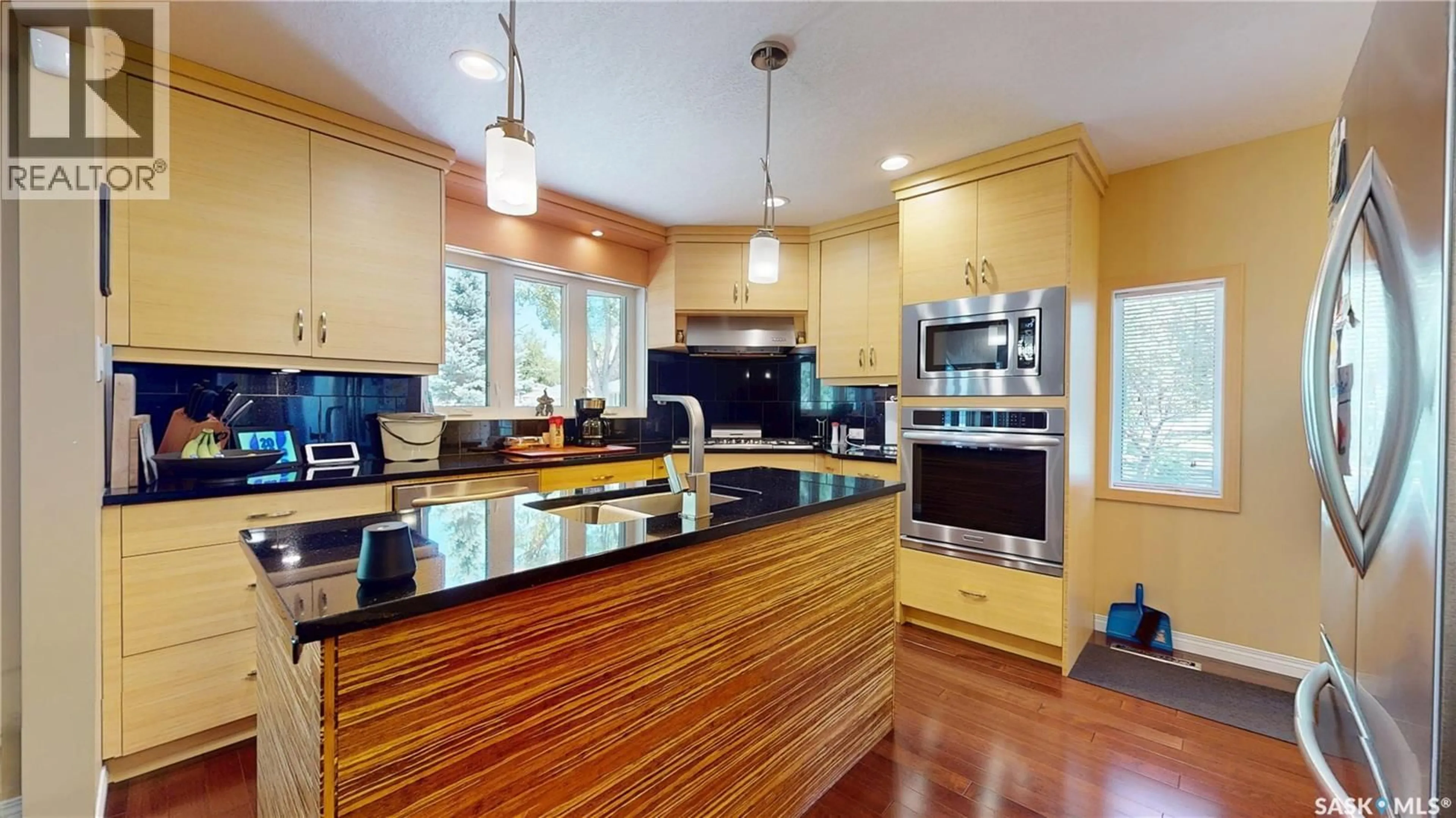 Open concept kitchen, wood/laminate floor for 3307/3309 DAWSON CRESCENT, Regina Saskatchewan S4R3V6