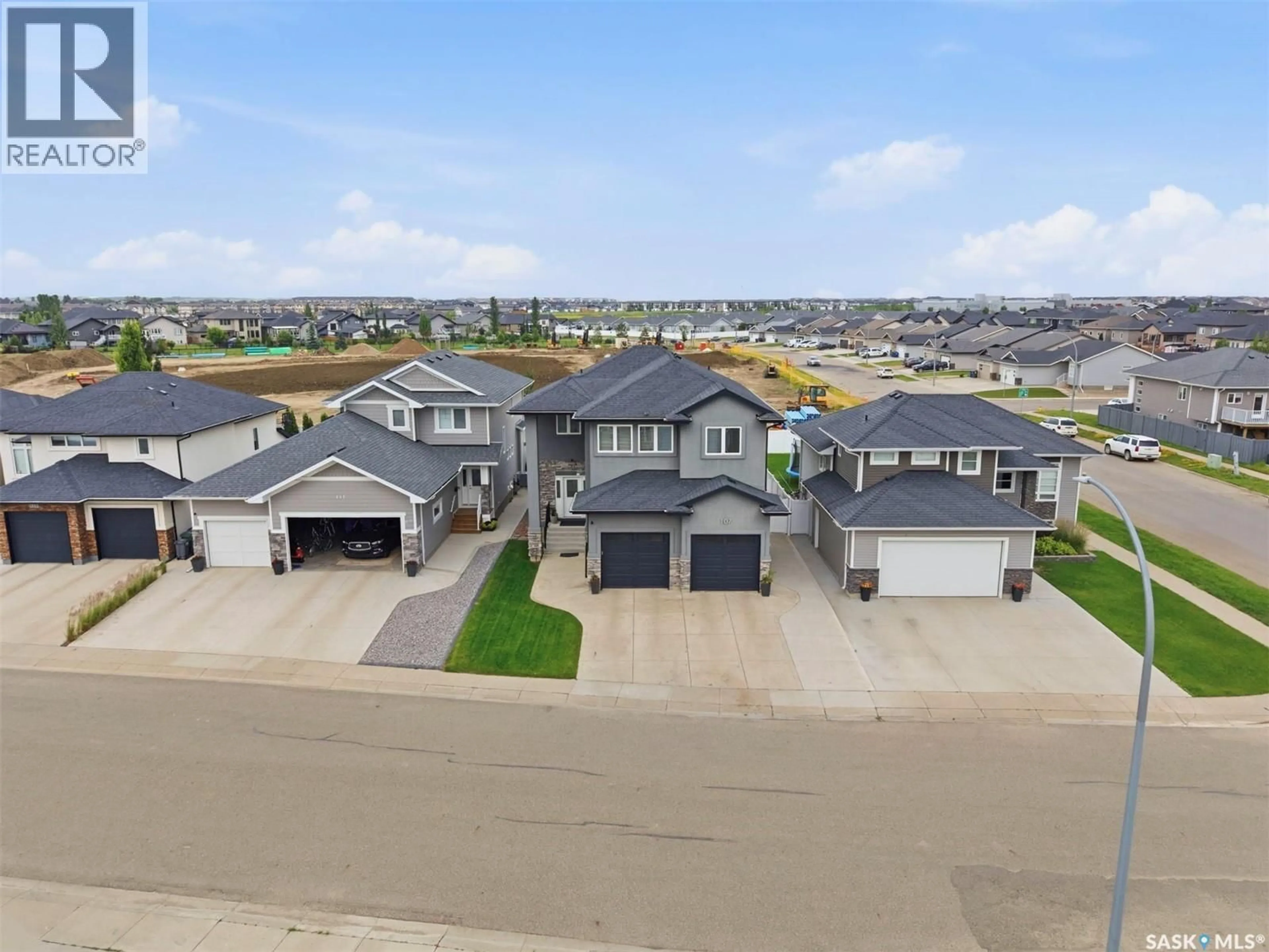 A pic from outside/outdoor area/front of a property/back of a property/a pic from drone, street for 107 SCHUMACHER BAY, Saskatoon Saskatchewan S7V0H7
