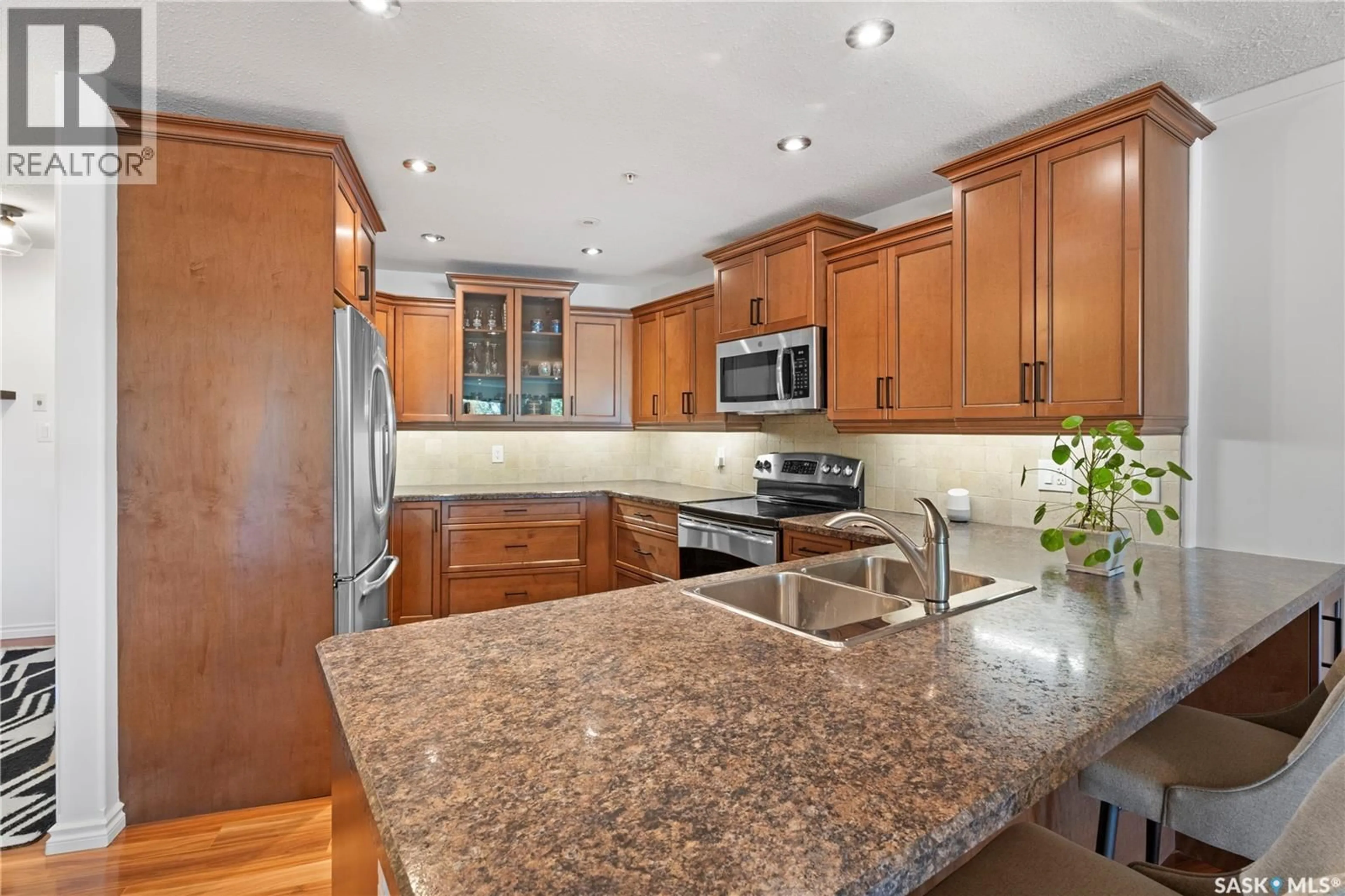 Open concept kitchen, ceramic/tile floor for 103 - 1602 1ST STREET, Prince Albert Saskatchewan S6V1G7
