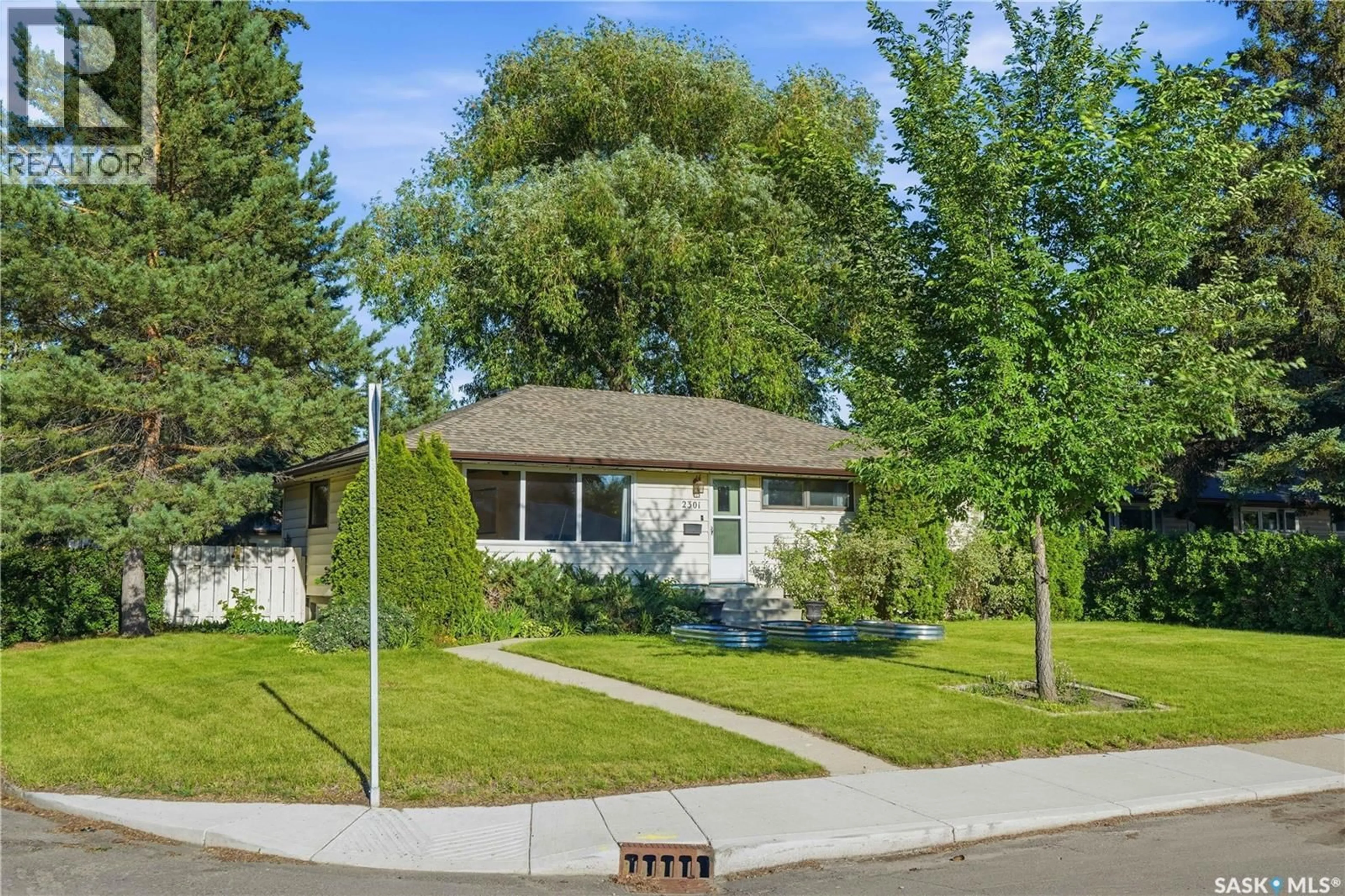 Home with vinyl exterior material, street for 2301 CAIRNS AVENUE, Saskatoon Saskatchewan S7J1T9