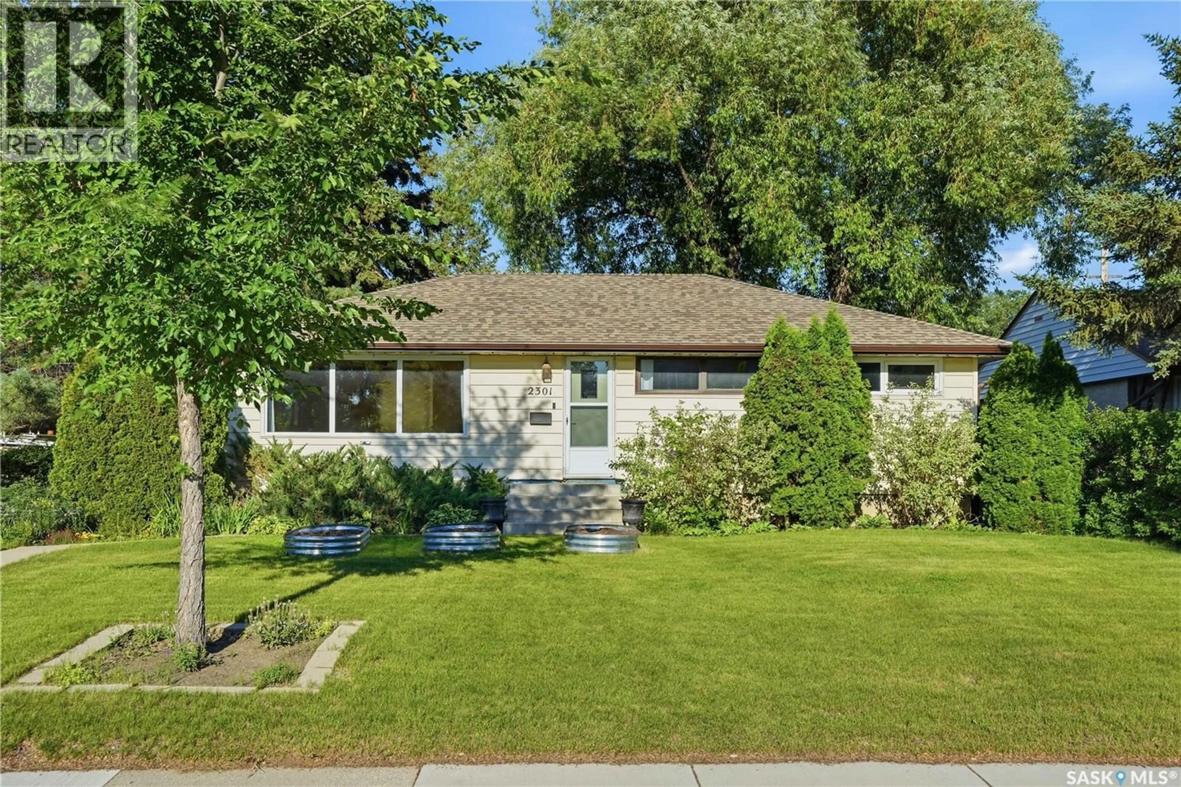 Home with vinyl exterior material, street for 2301 CAIRNS AVENUE, Saskatoon Saskatchewan S7J1T9