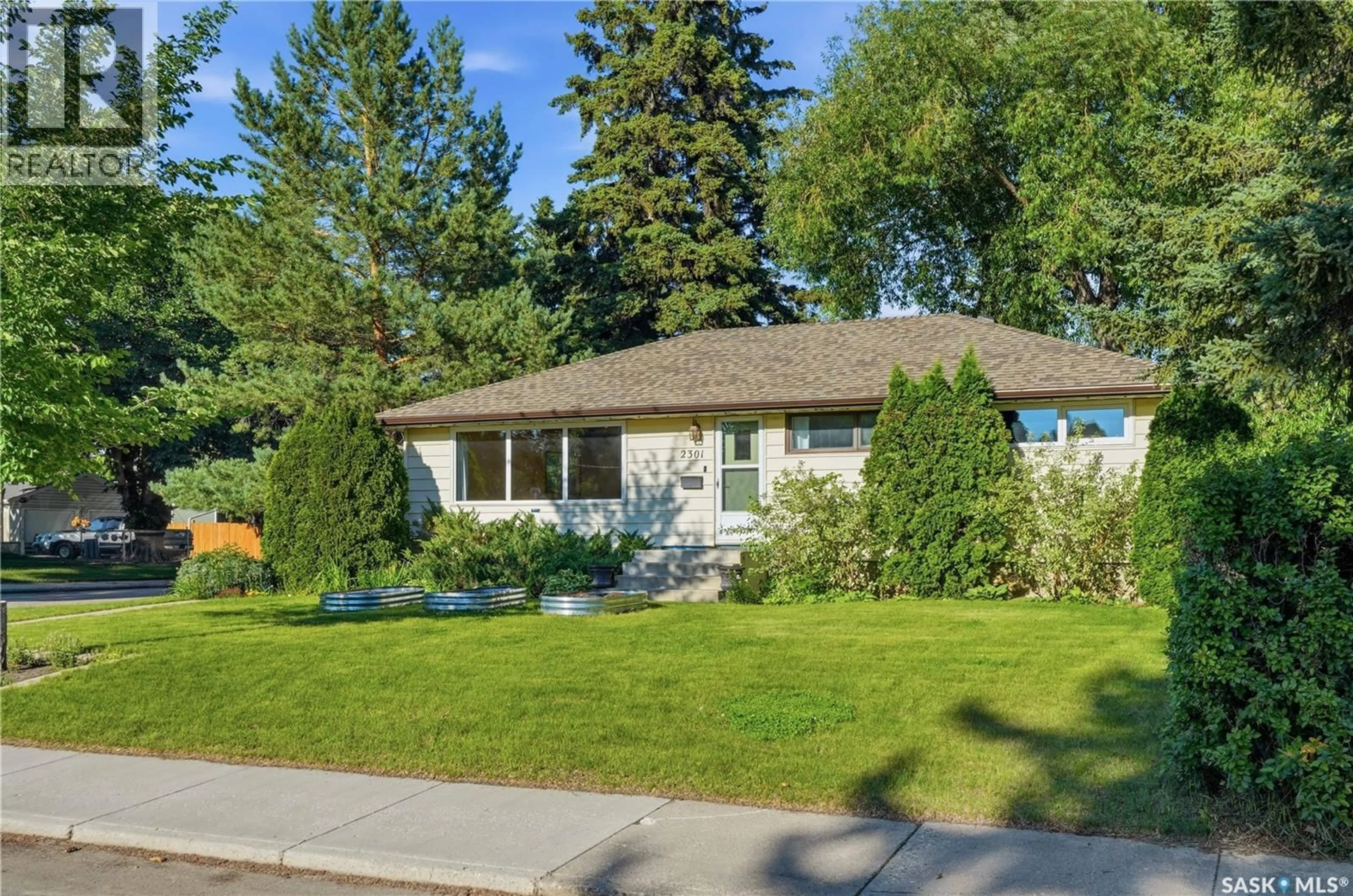 Home with vinyl exterior material, street for 2301 CAIRNS AVENUE, Saskatoon Saskatchewan S7J1T9