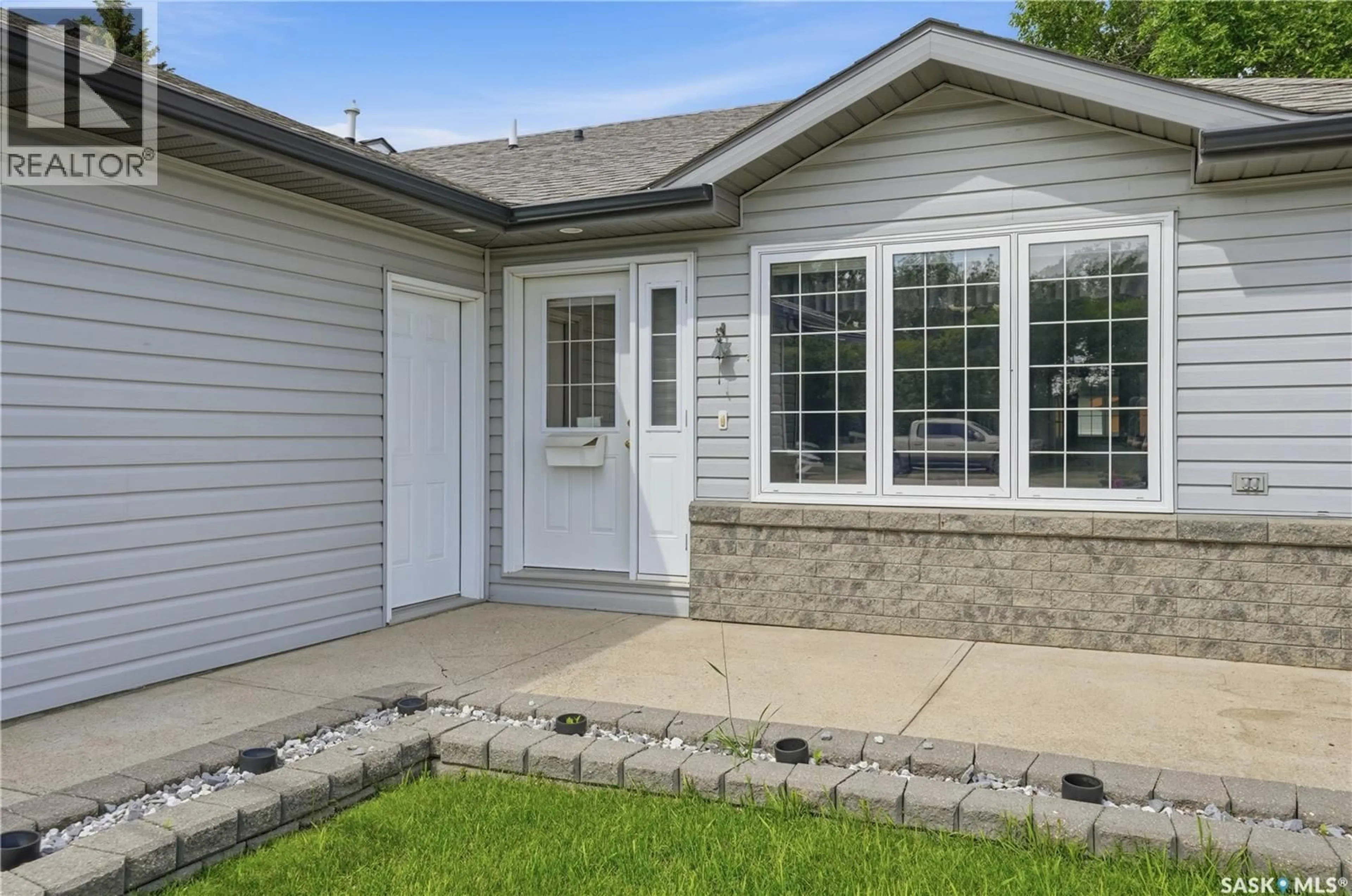 Home with vinyl exterior material, street for 910 1ST STREET, Assiniboia Saskatchewan S0H0B0