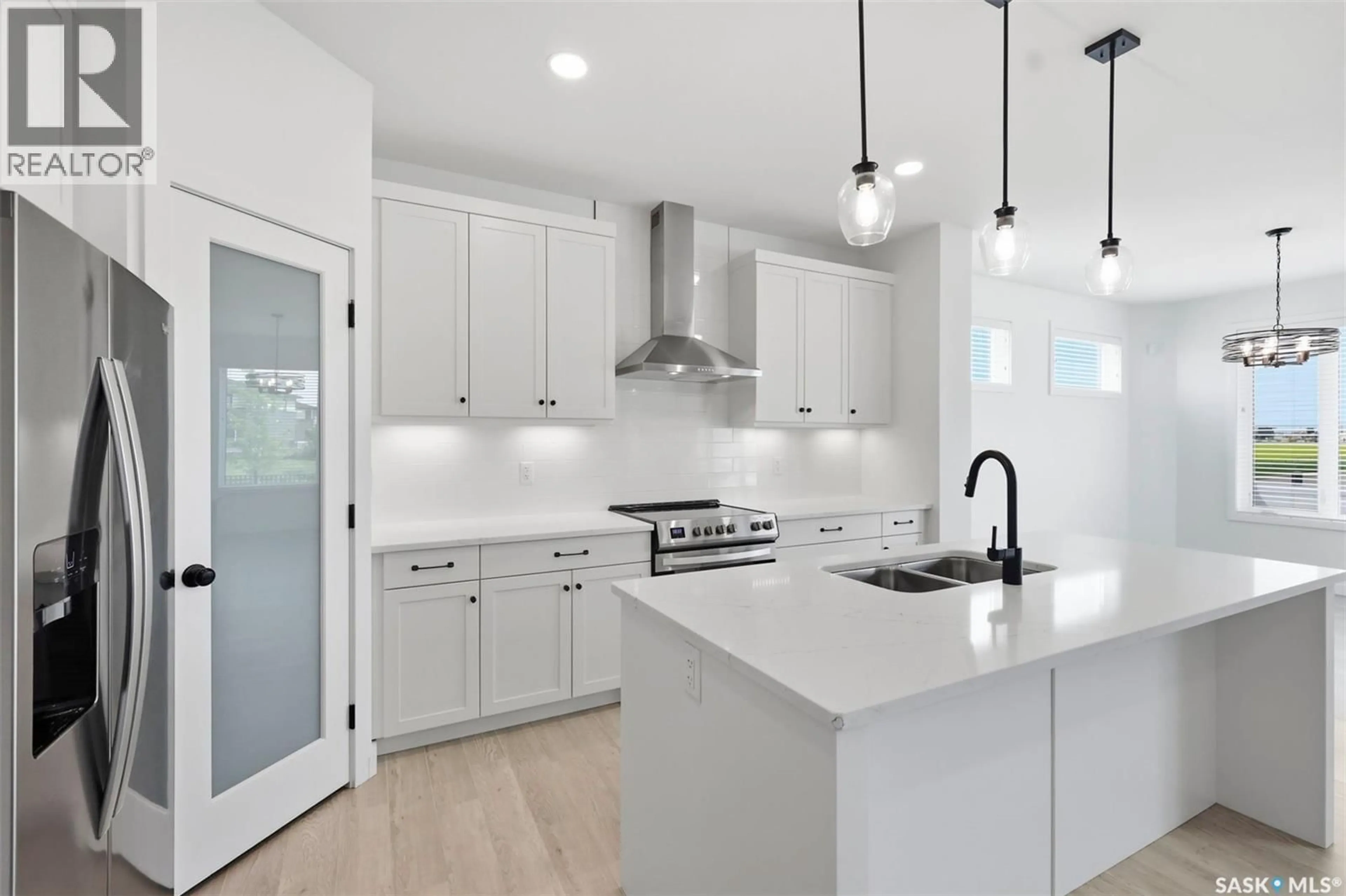 Open concept kitchen, ceramic/tile floor for 104 FORSEY AVENUE, Saskatoon Saskatchewan S7W1C8