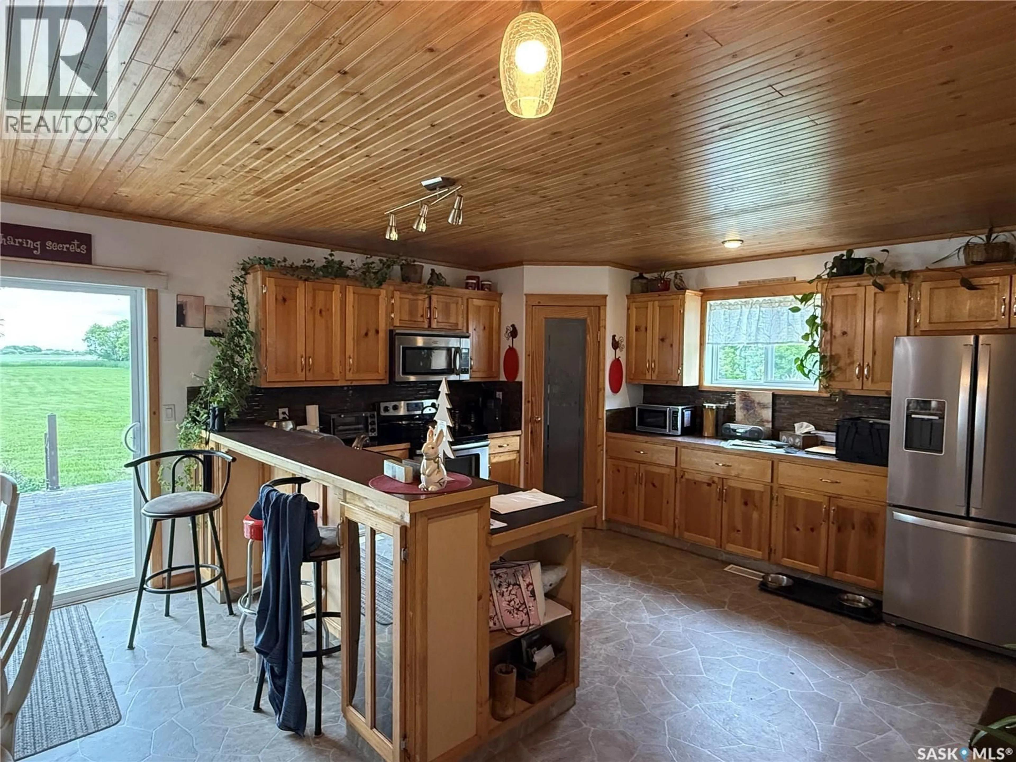 Open concept kitchen, wood/laminate floor for BRECELJ ACREAGE, Corman Park Rm No. 344 Saskatchewan S7K3J5