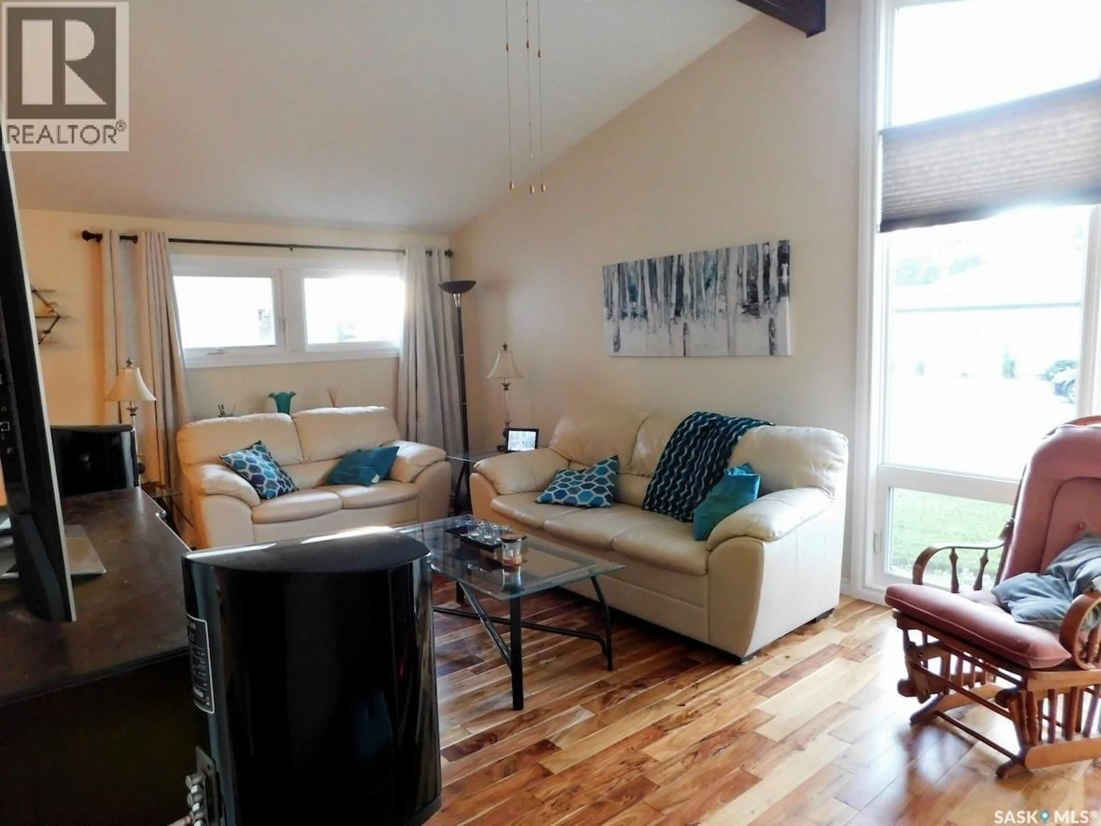 Living room with furniture, wood/laminate floor for 41 KASPER CRESCENT, Assiniboia Saskatchewan S0H0B0