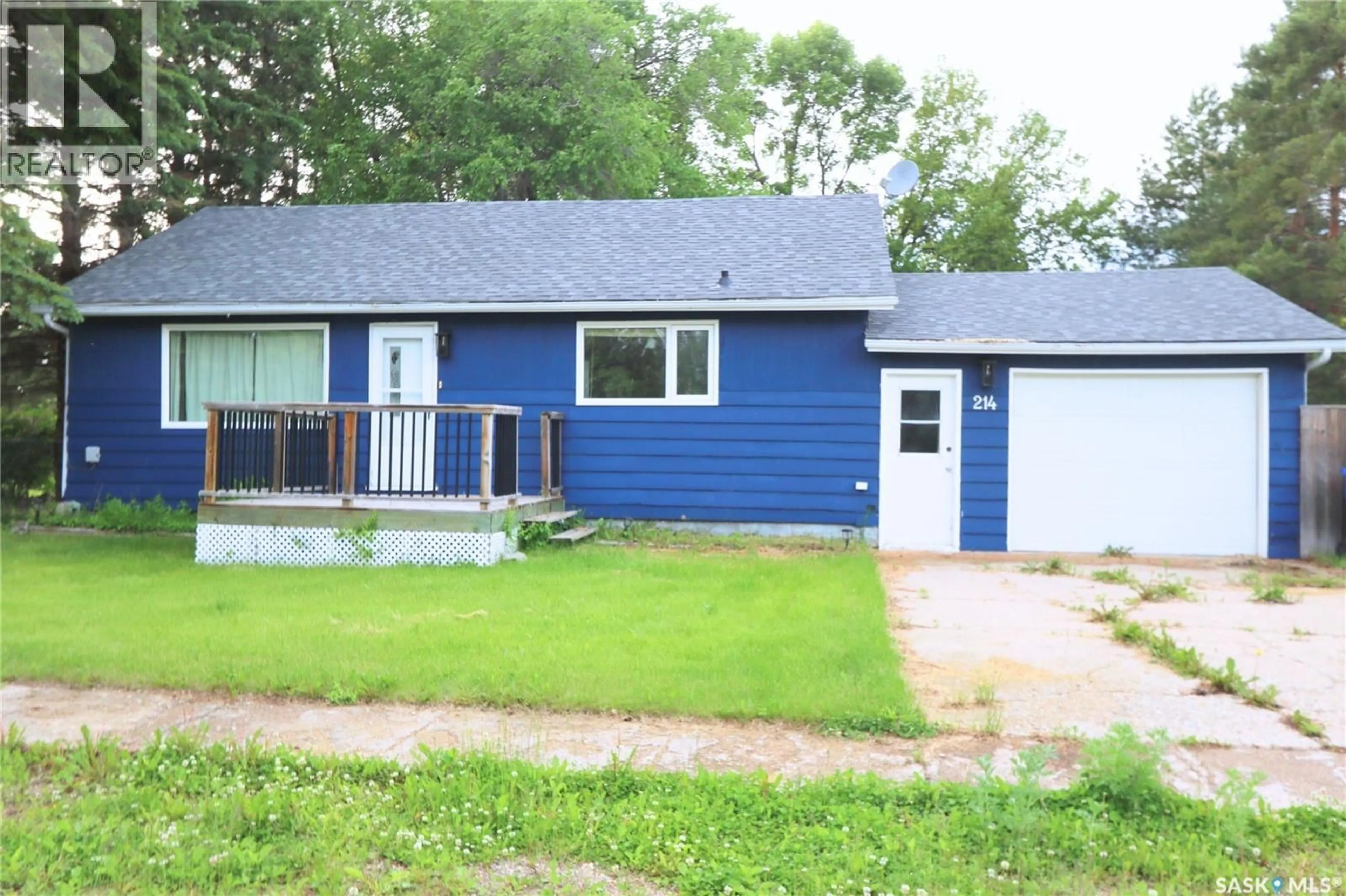 Home with vinyl exterior material, street for 214 MAIN STREET, Springside Saskatchewan S0A3V0