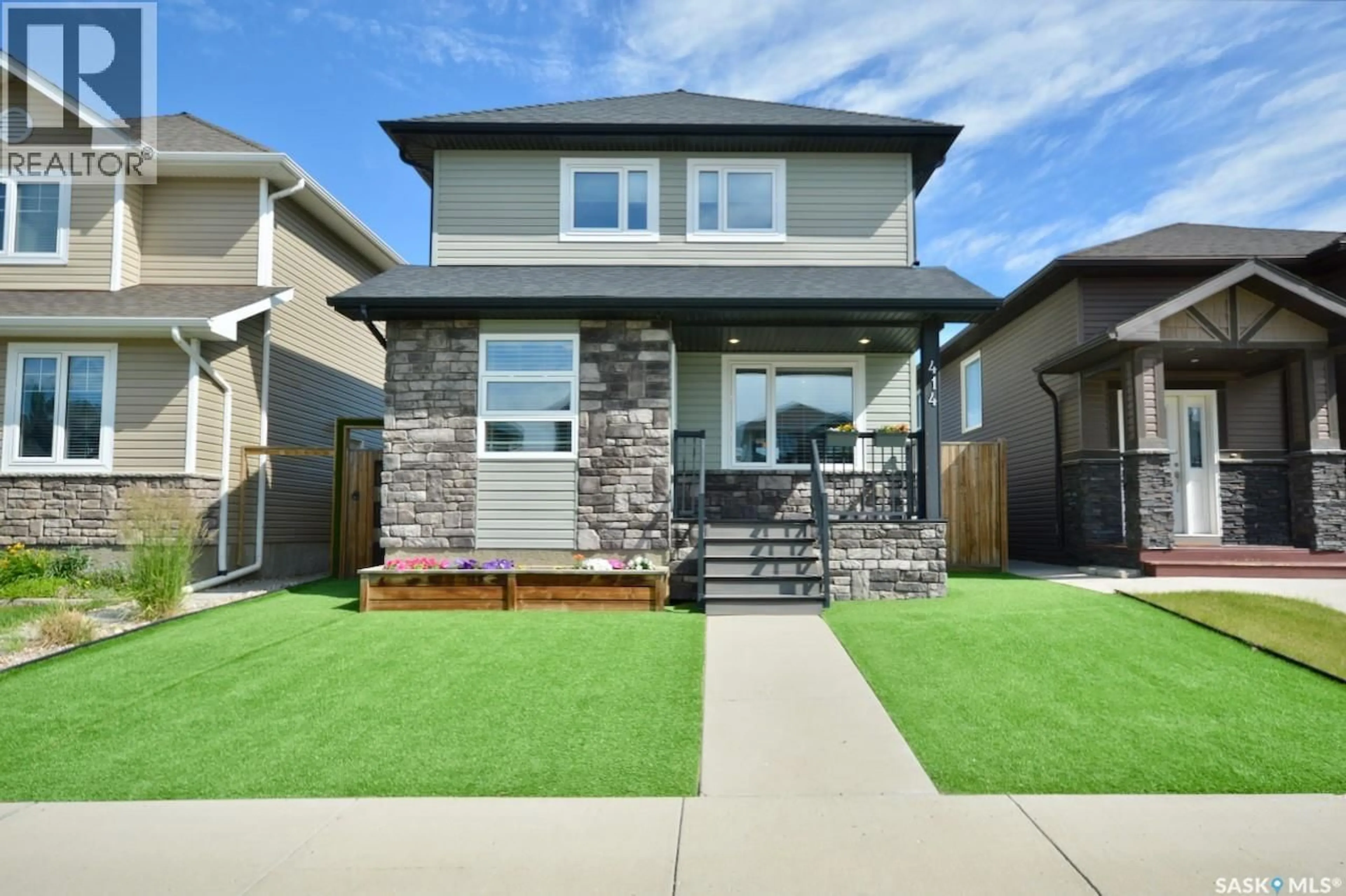 Home with brick exterior material, street for 414 VELTKAMP CRESCENT, Saskatoon Saskatchewan S7T0S2