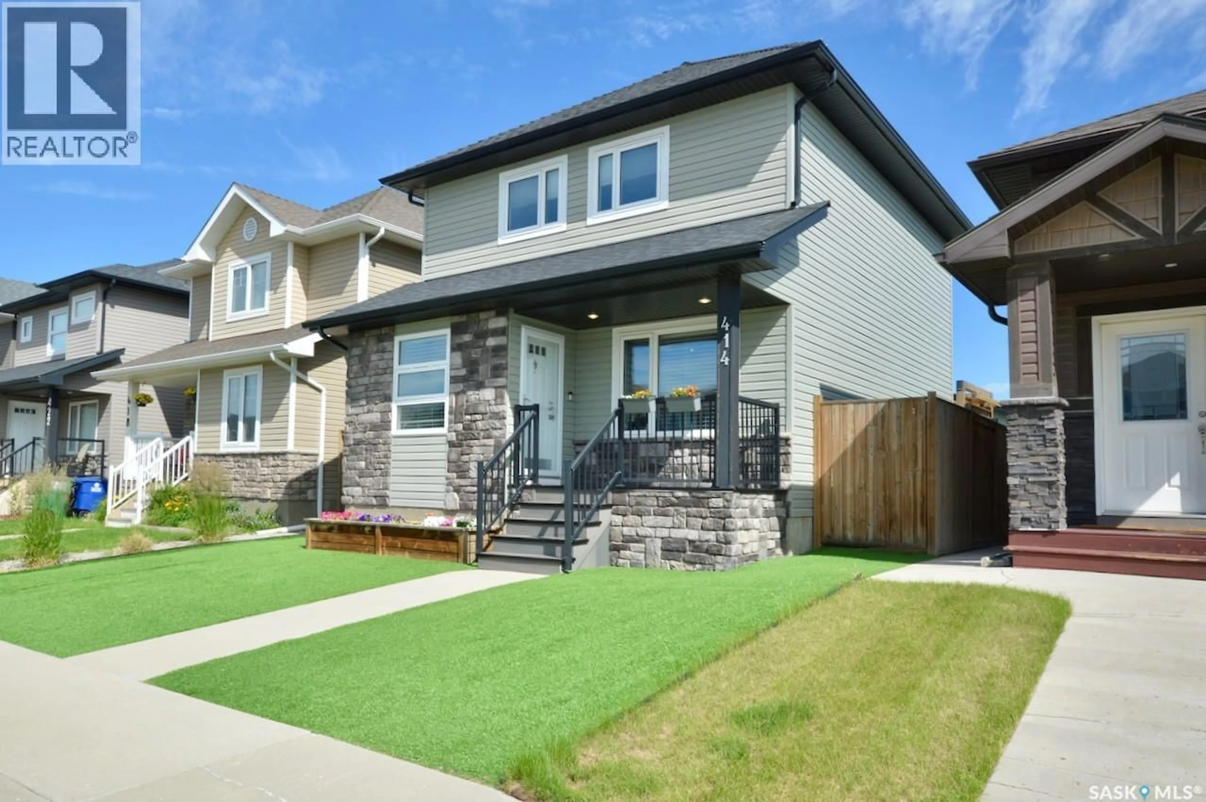 Home with vinyl exterior material, street for 414 VELTKAMP CRESCENT, Saskatoon Saskatchewan S7T0S2