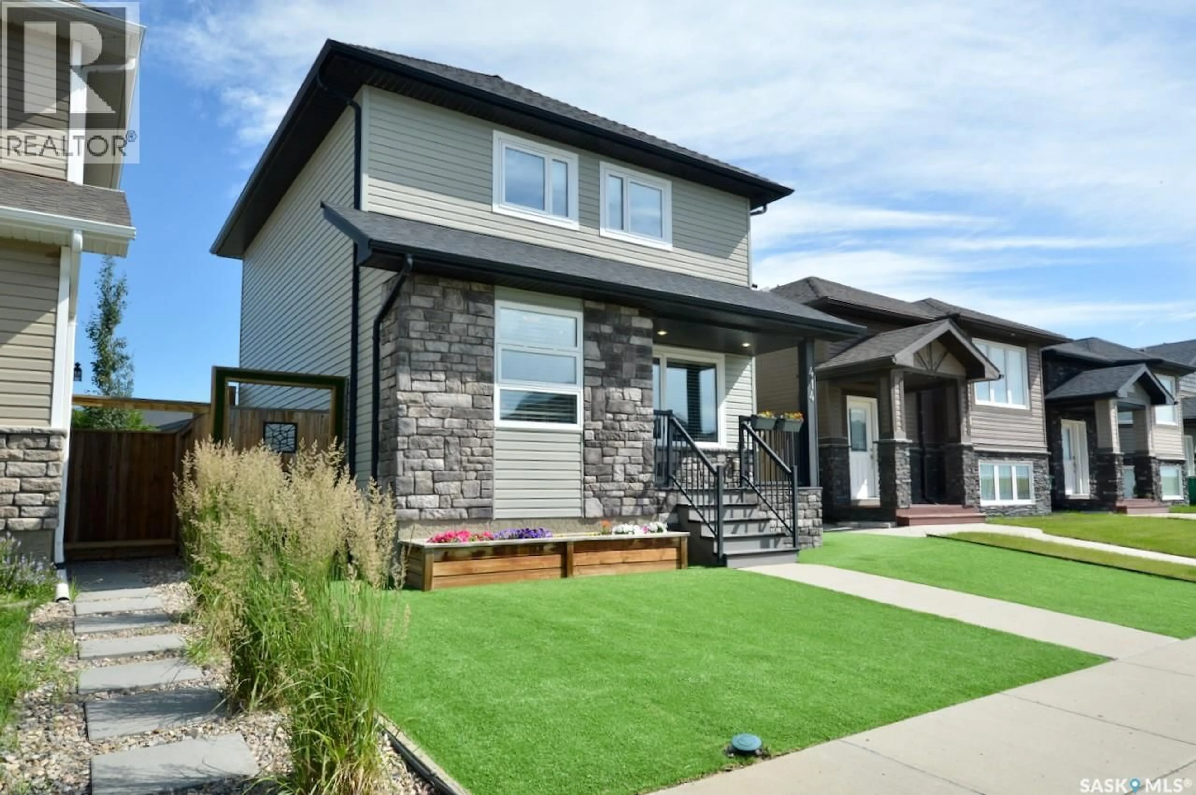 Home with vinyl exterior material, street for 414 VELTKAMP CRESCENT, Saskatoon Saskatchewan S7T0S2