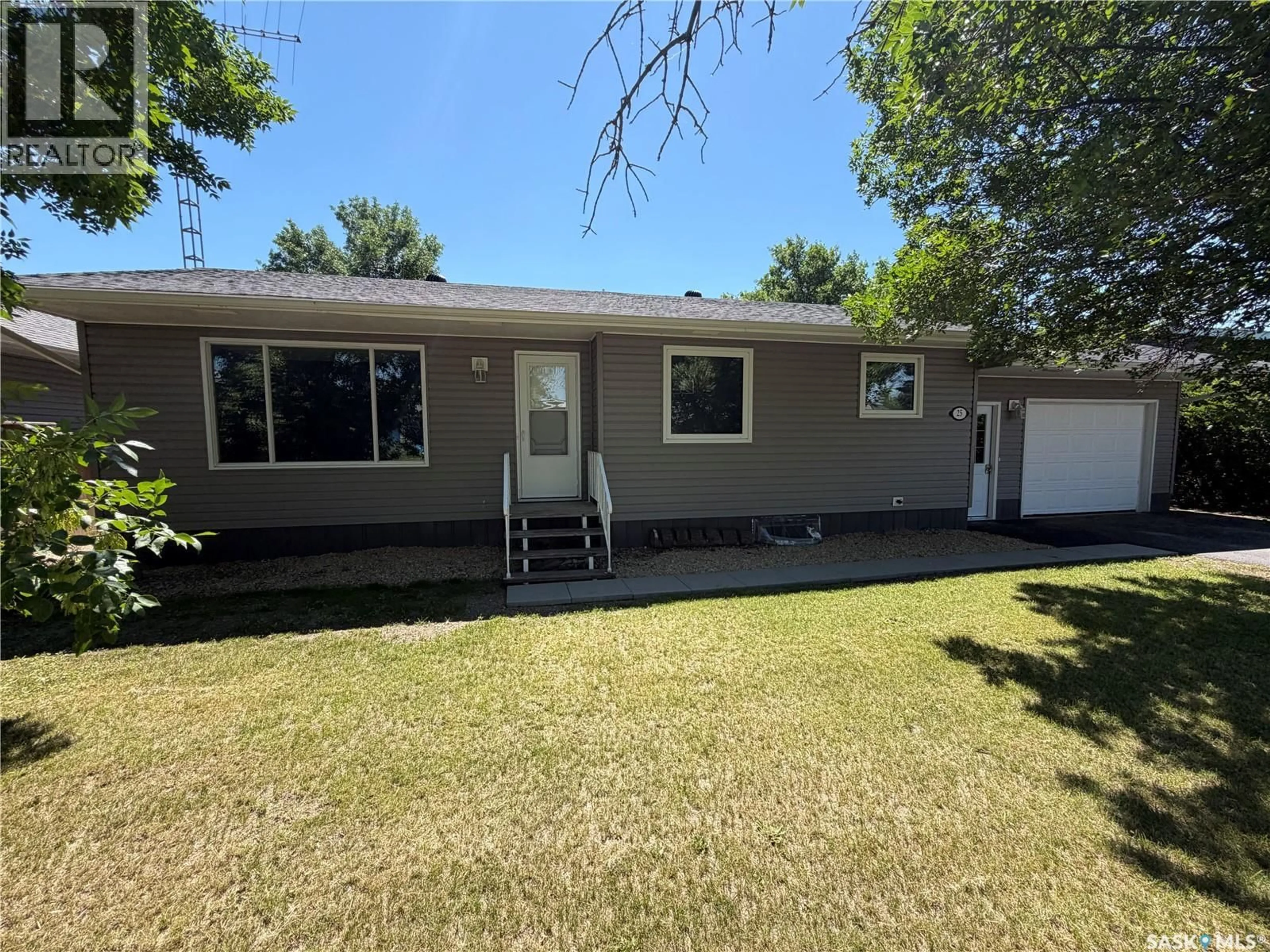 Home with vinyl exterior material, street for 25 SOURIS AVENUE, Redvers Saskatchewan S0C0A5