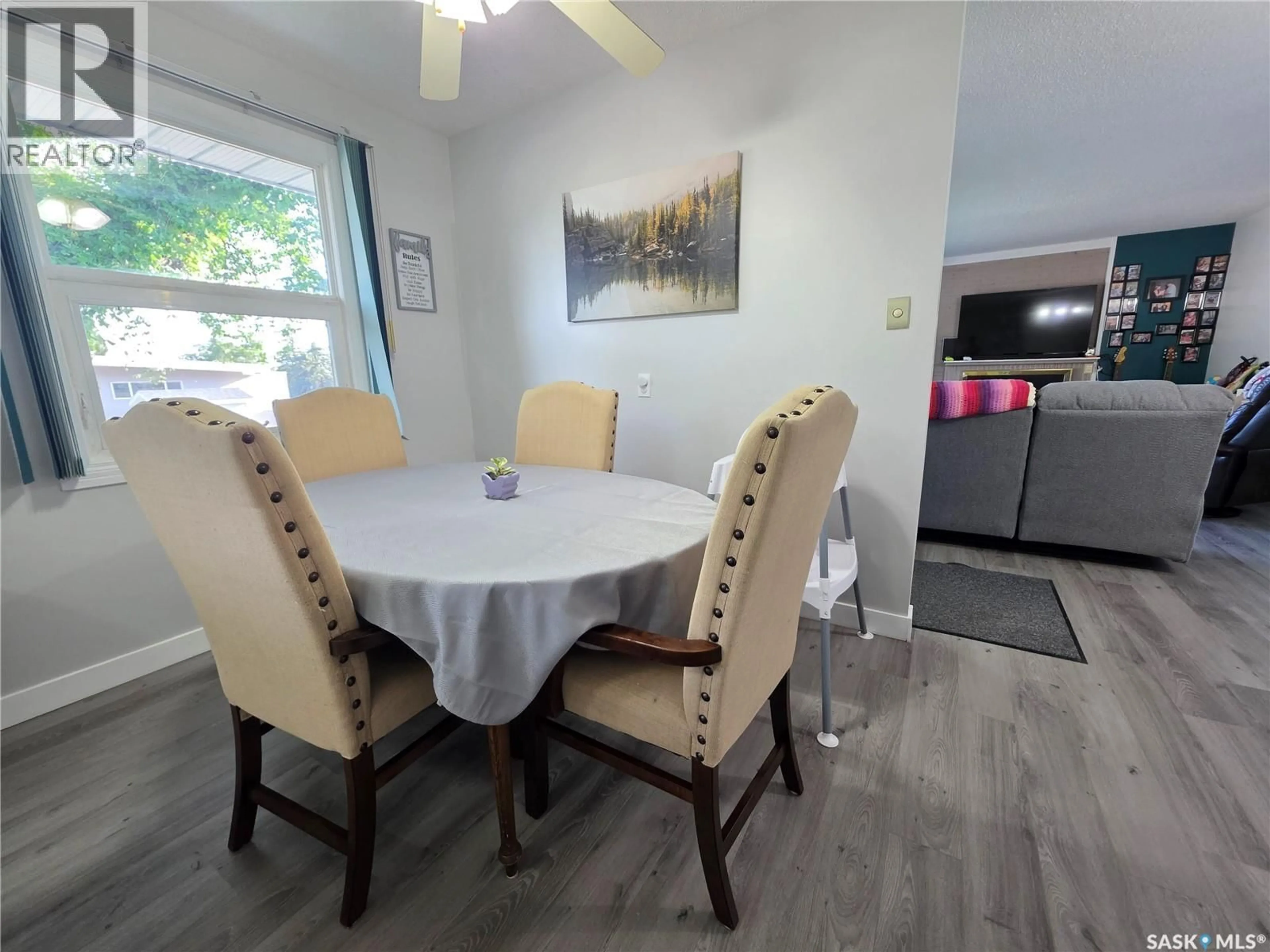 Dining room, wood/laminate floor for 303 13TH AVENUE, Swift Current Saskatchewan S9H2V9