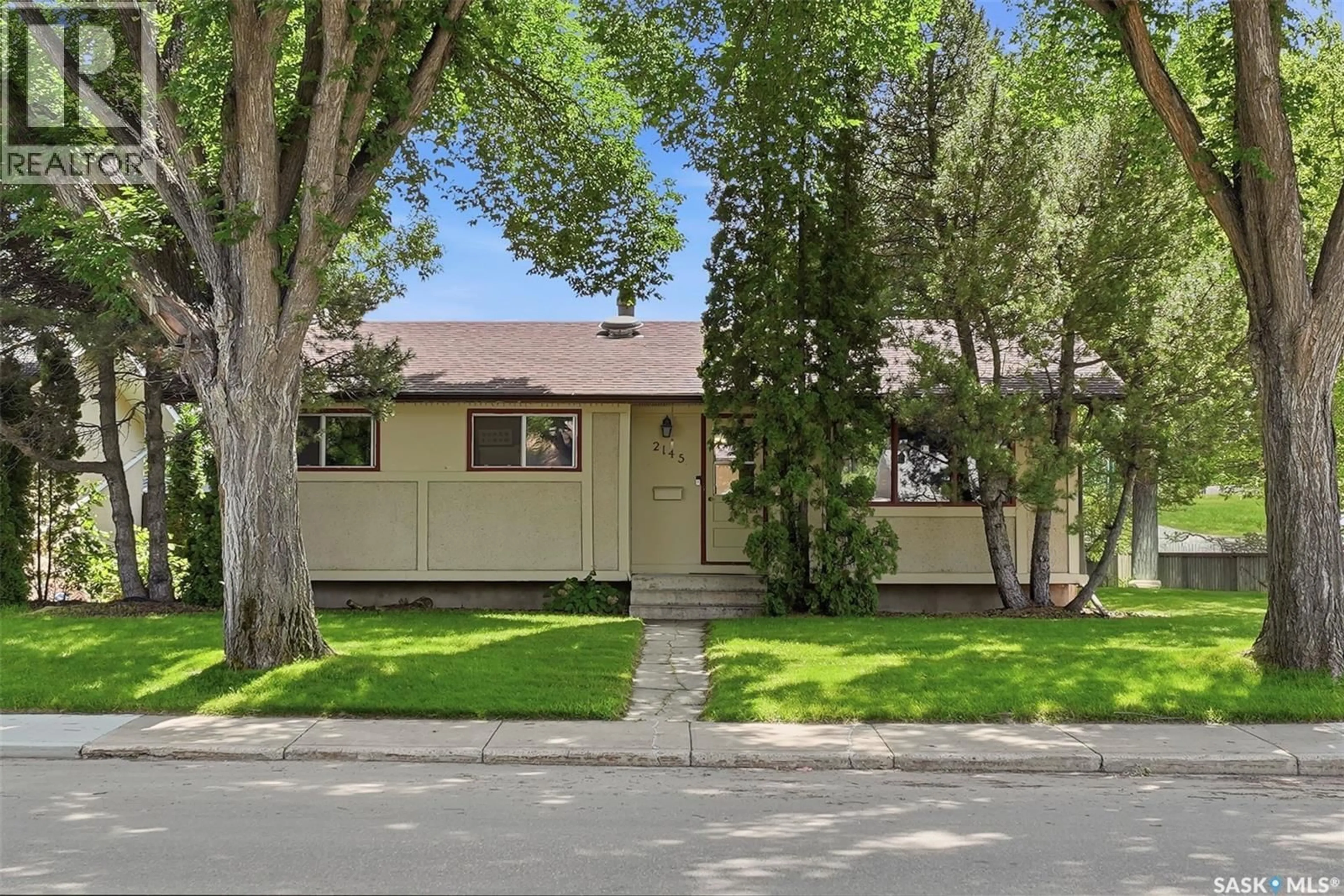 Home with vinyl exterior material, street for 2145 37TH STREET, Saskatoon Saskatchewan S7L4E6