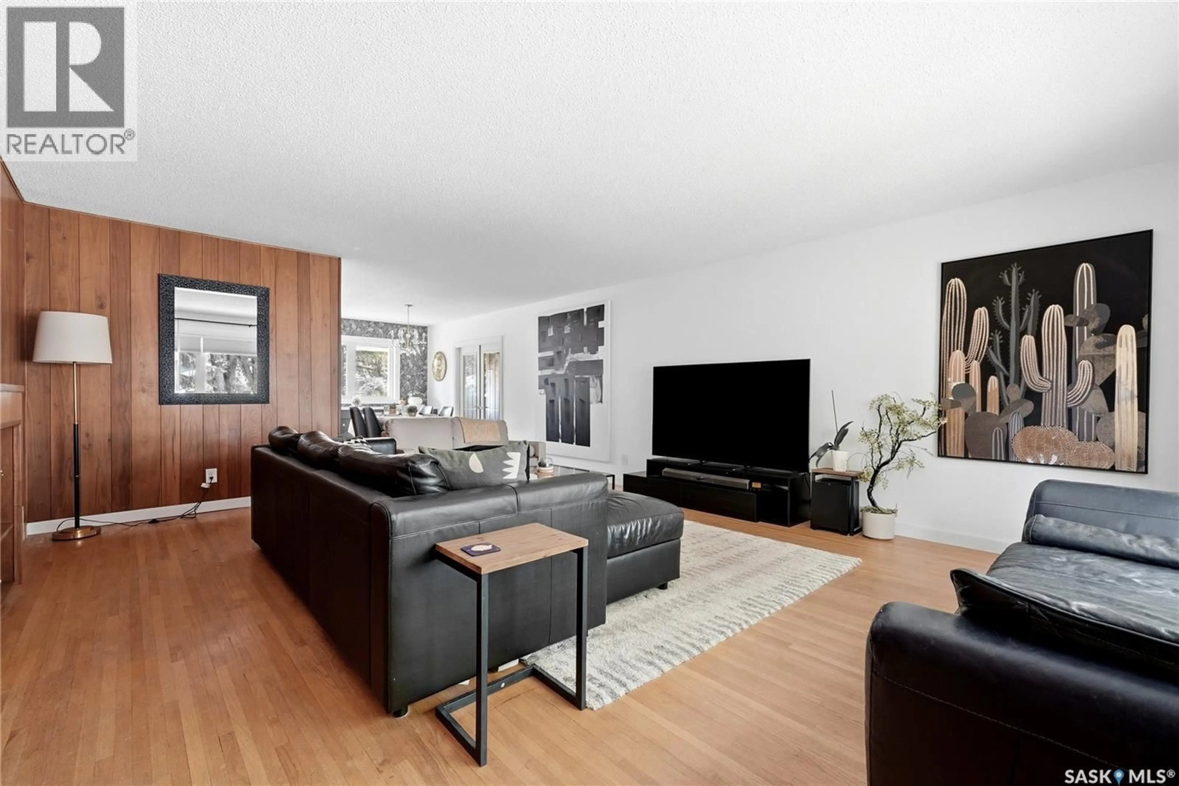 Living room with furniture, wood/laminate floor for 111 BELL STREET, Regina Saskatchewan S4S4C2