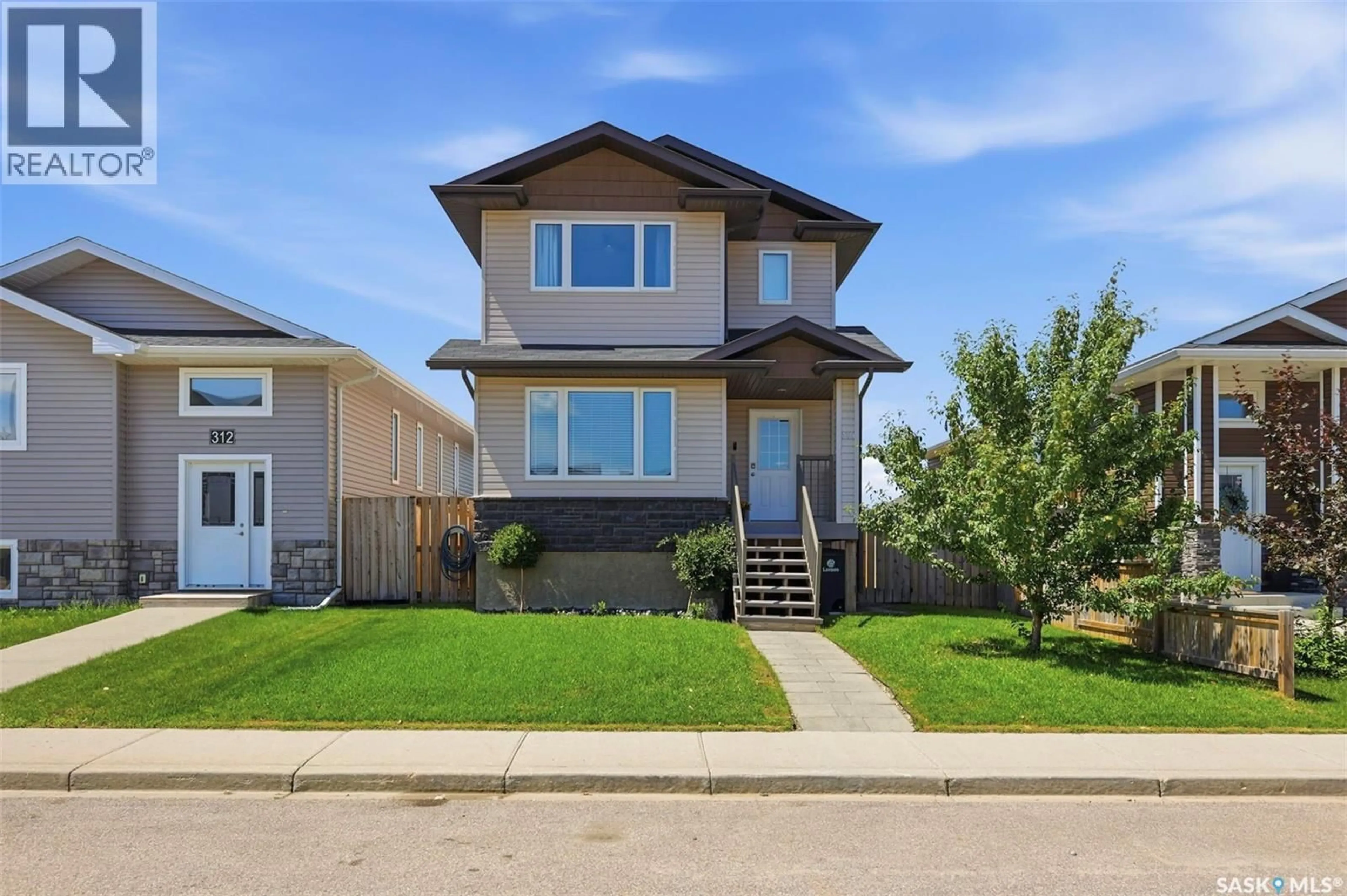 Home with vinyl exterior material, street for 310 MARTENS AVENUE, Warman Saskatchewan S0K4S3
