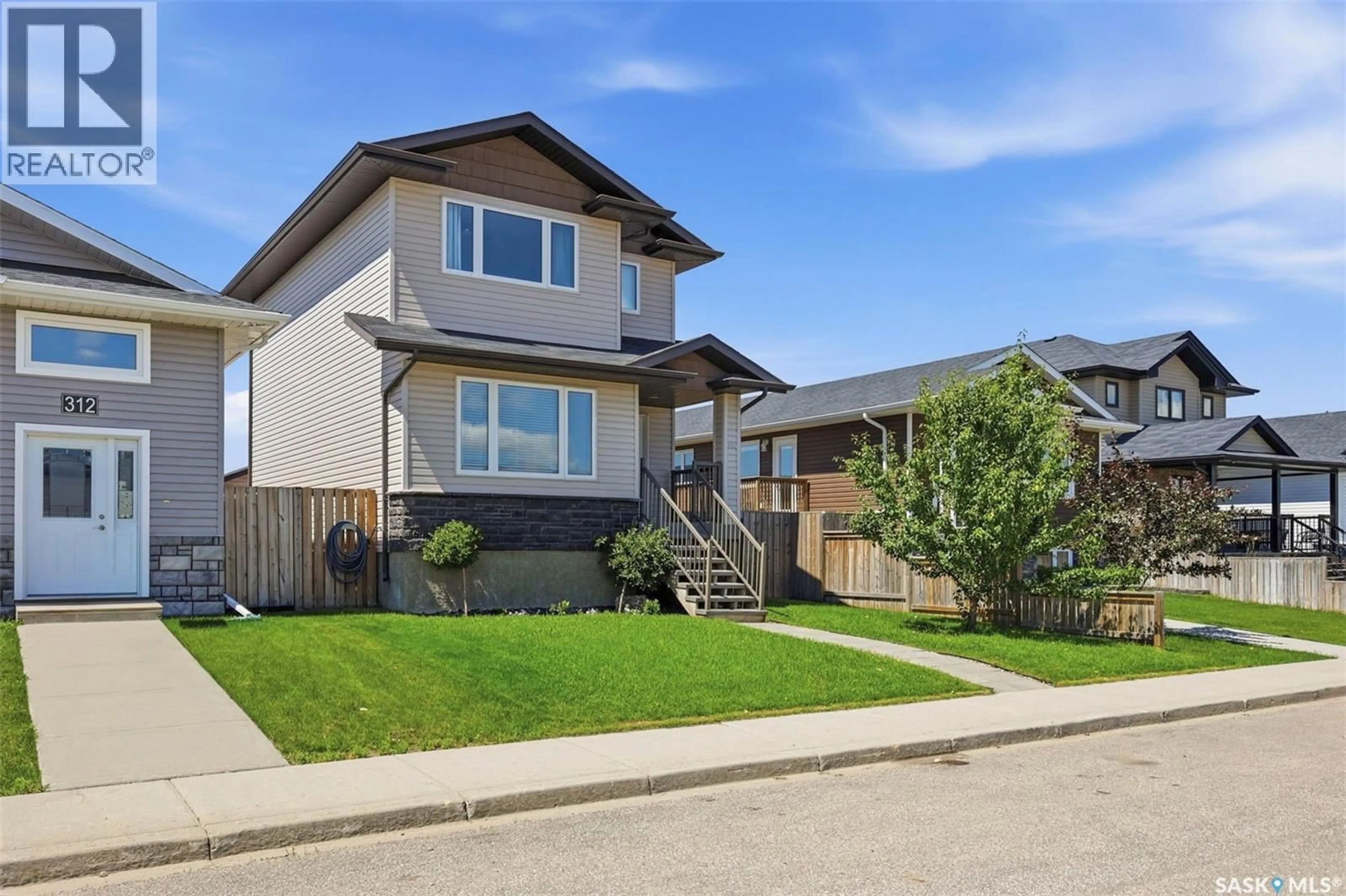 Home with vinyl exterior material, street for 310 MARTENS AVENUE, Warman Saskatchewan S0K4S3
