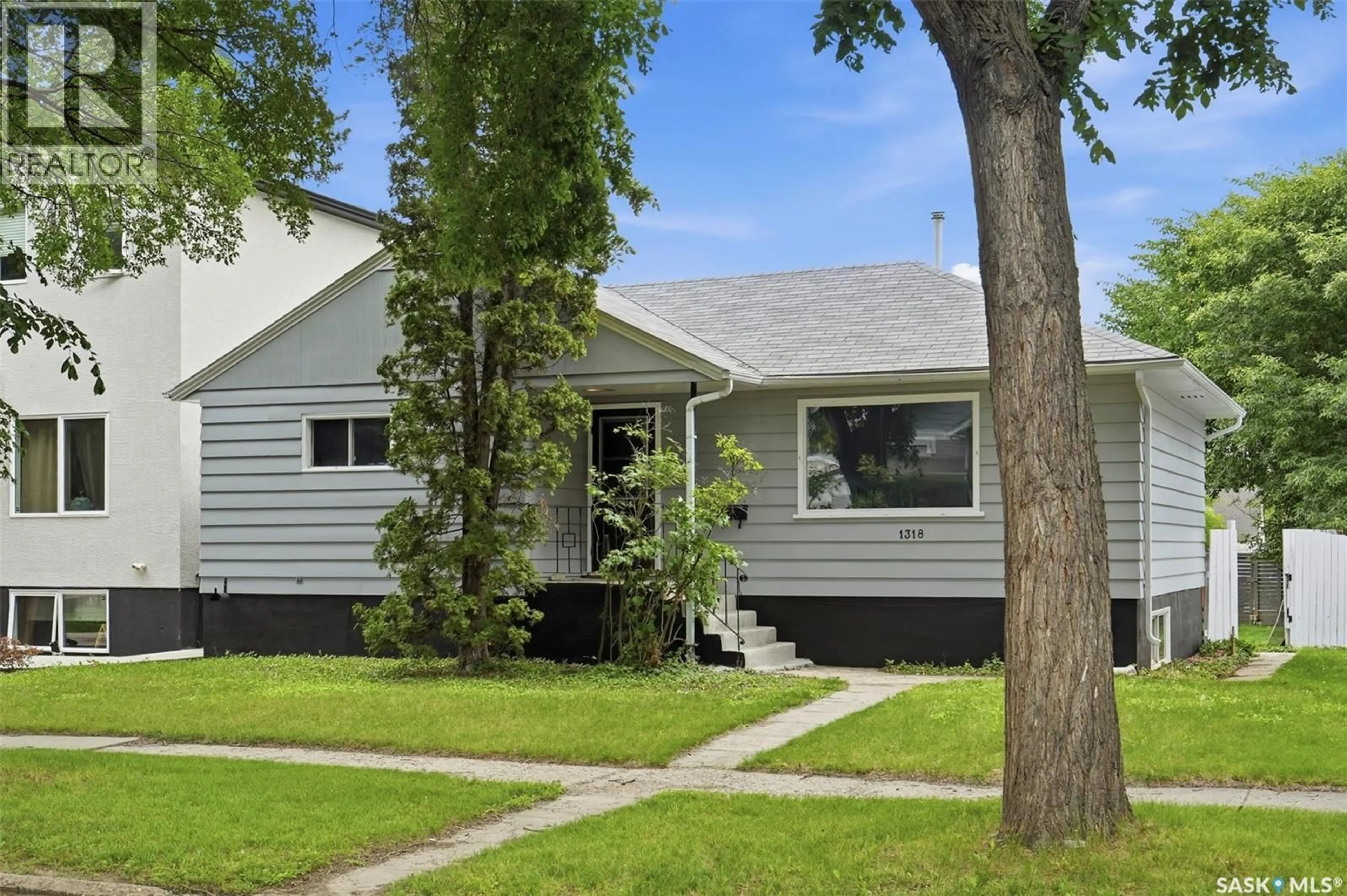 Home with vinyl exterior material, street for 1318 B AVENUE, Saskatoon Saskatchewan S7L1G5