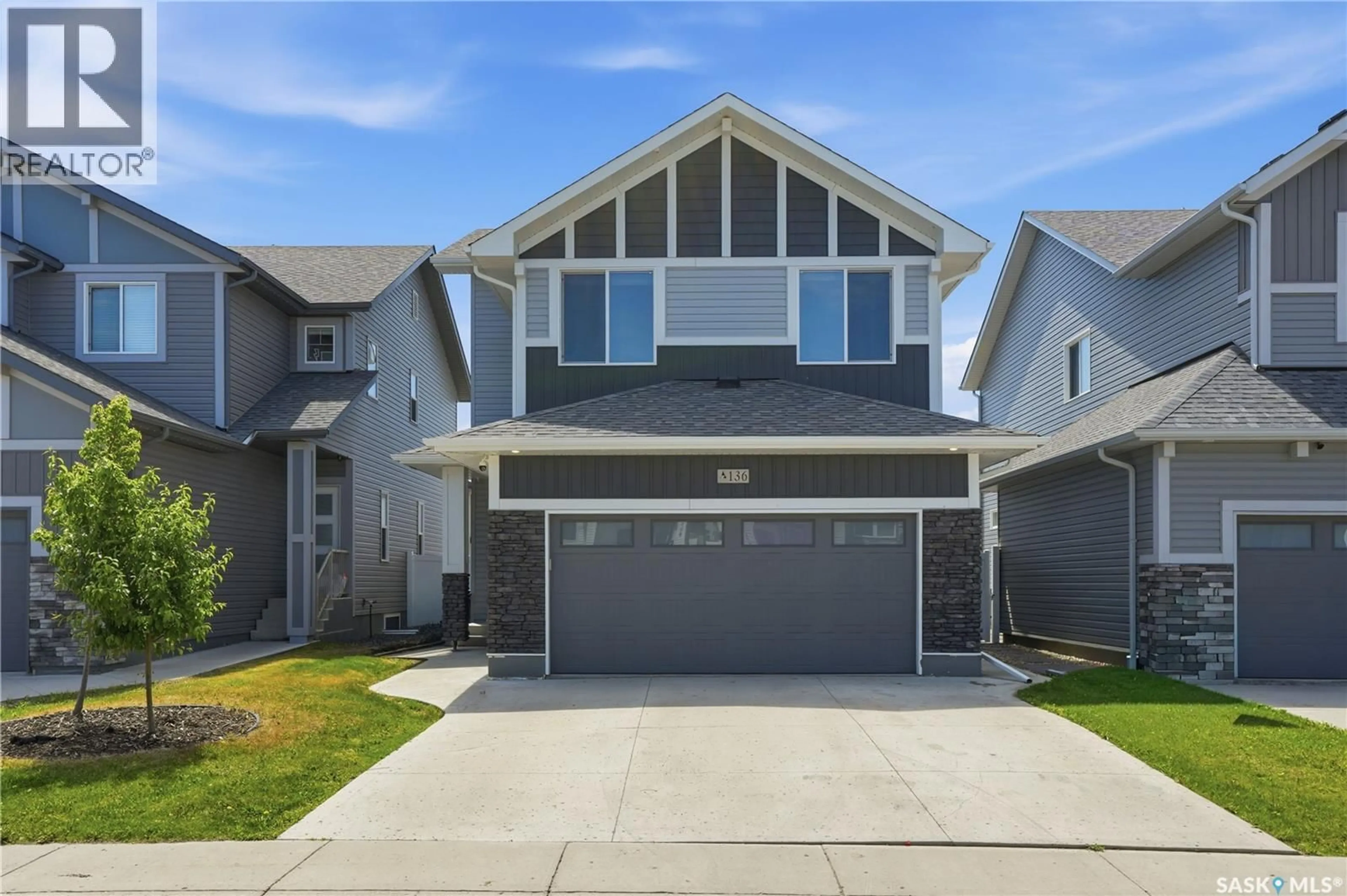 Home with vinyl exterior material, street for 136 THAKUR STREET, Saskatoon Saskatchewan S7W0Z6